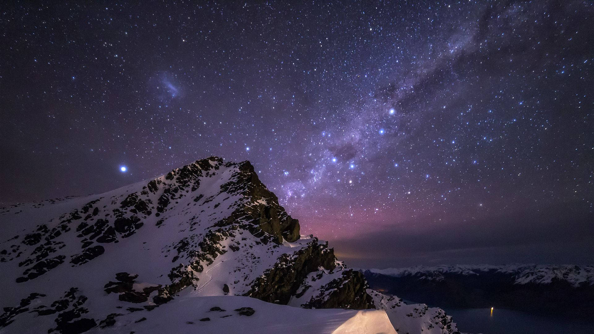 A Mountain With Snow And Stars Above It Background