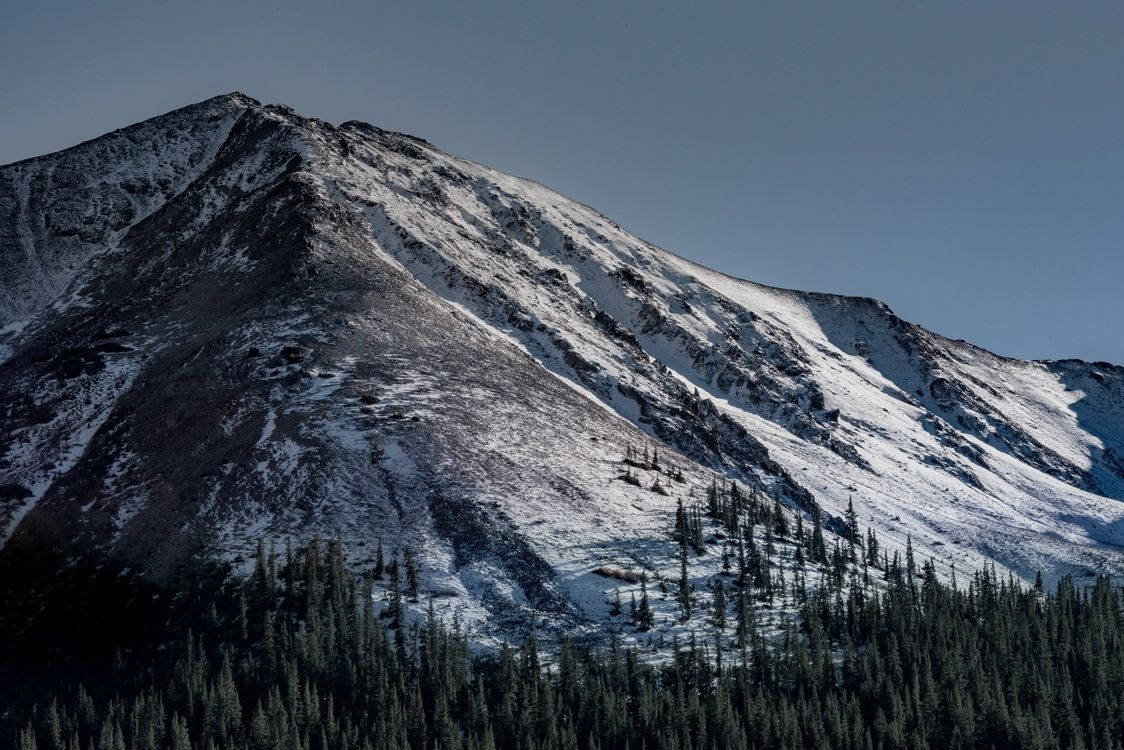 A Mountain With Snow On It Background