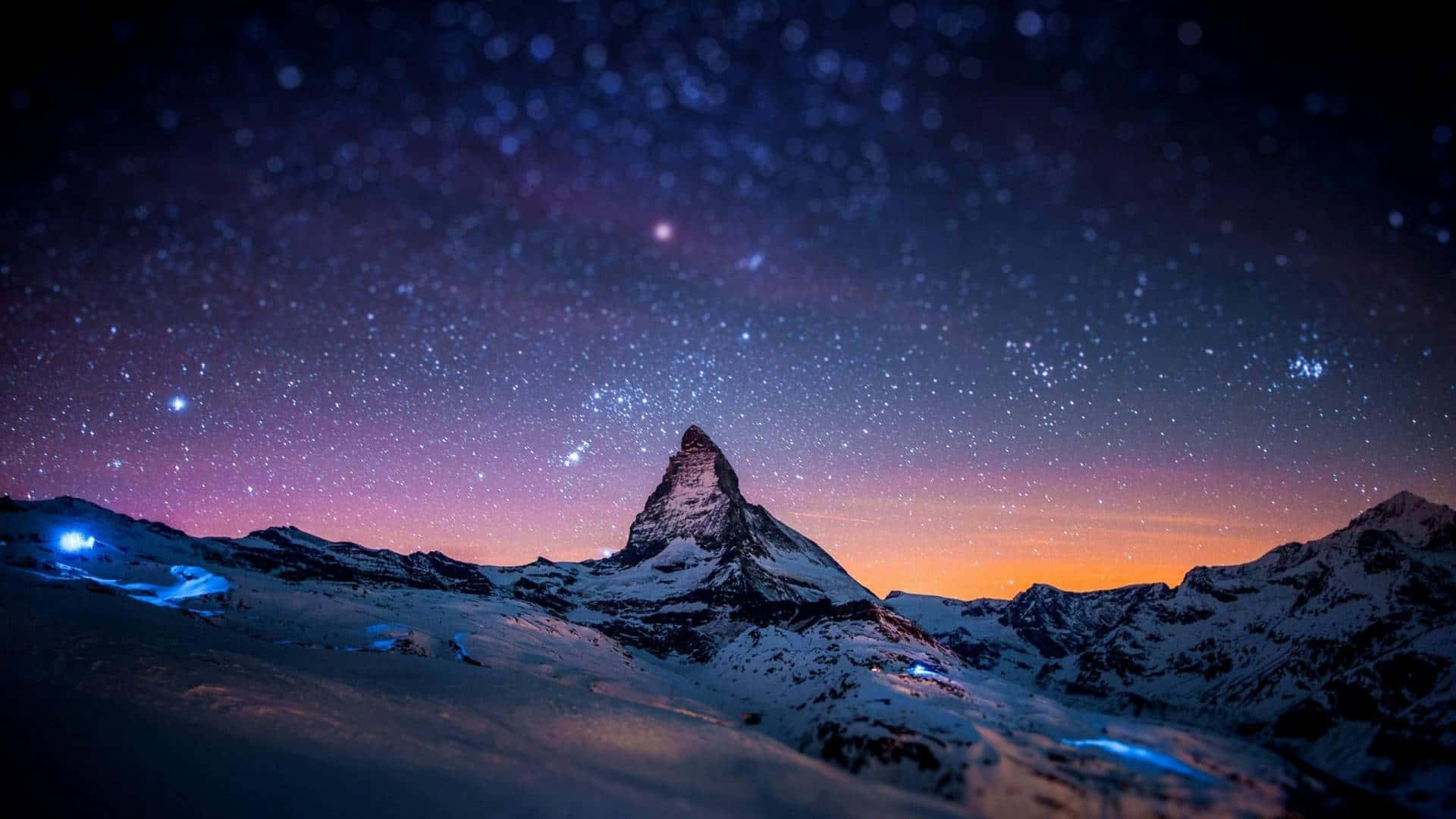 A Mountain With Stars Above It Background