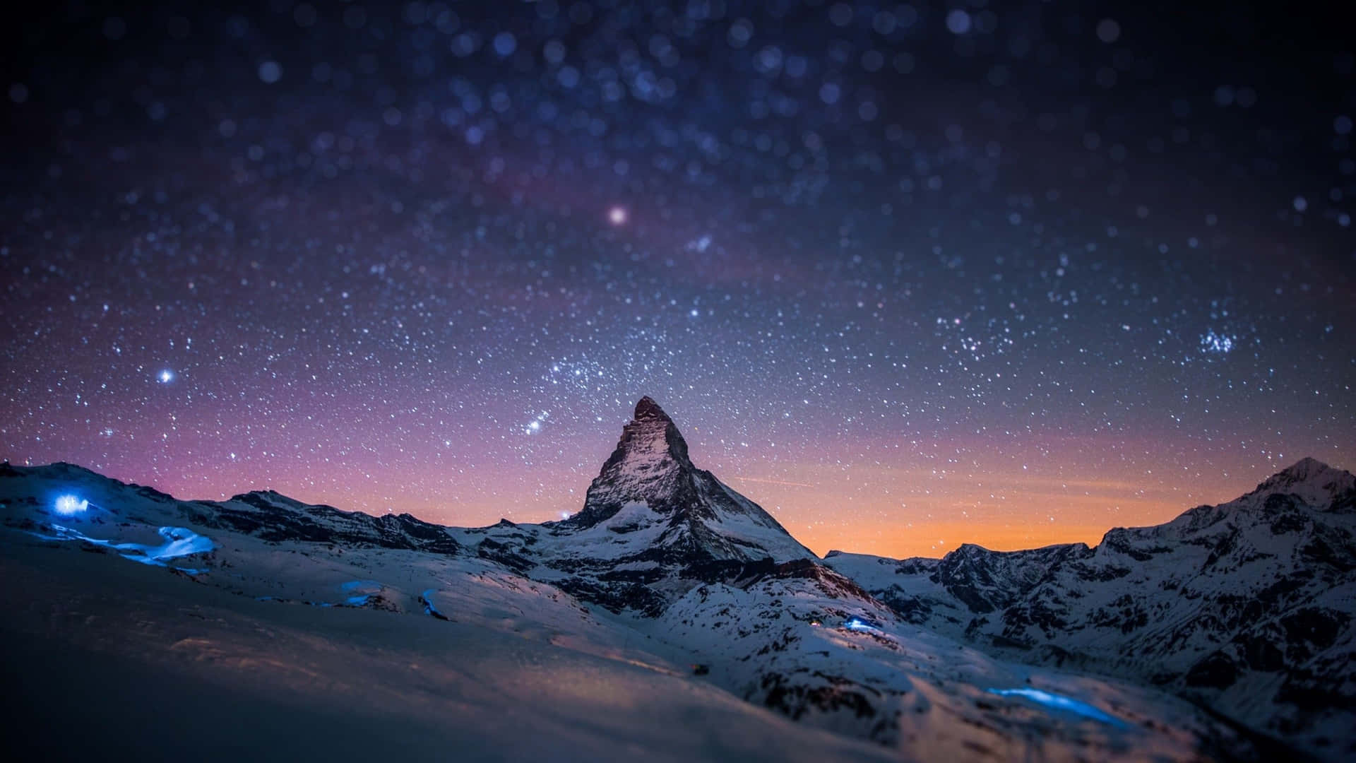 A Mountain With Stars And A Mountain Peak Background