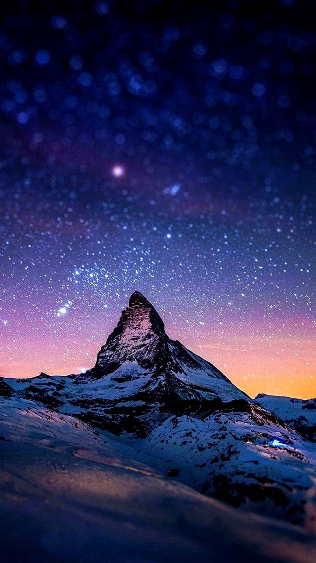 A Mountain With Stars And Snow Under The Night Sky Background