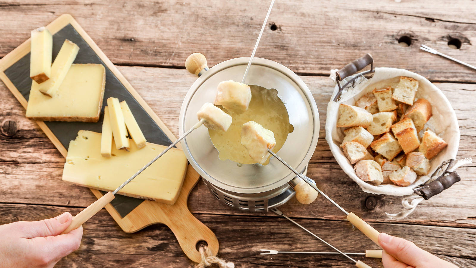 A Mouthwatering Cheese Fondue Feast Background