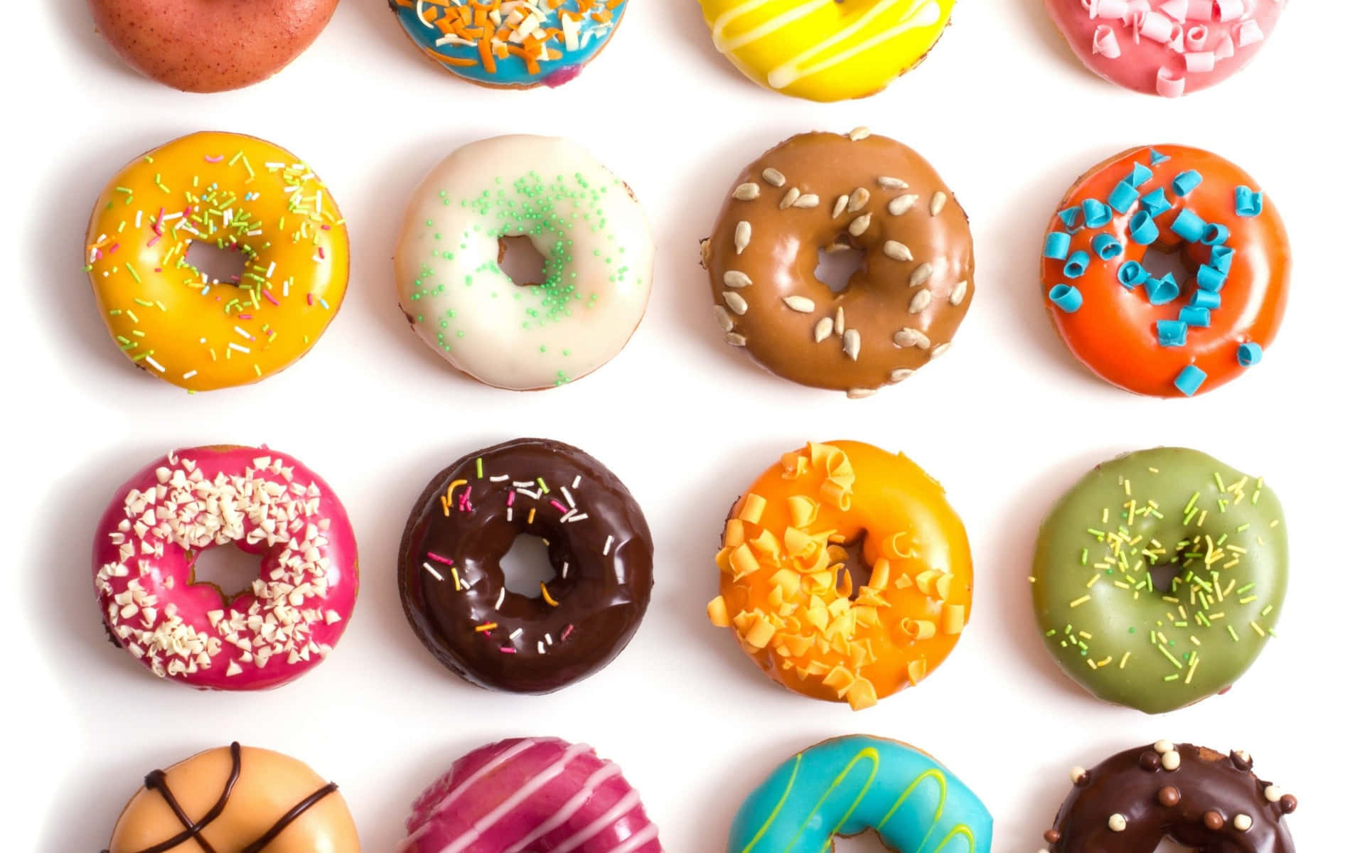 A Mouthwatering Display Of Assorted Donuts Background