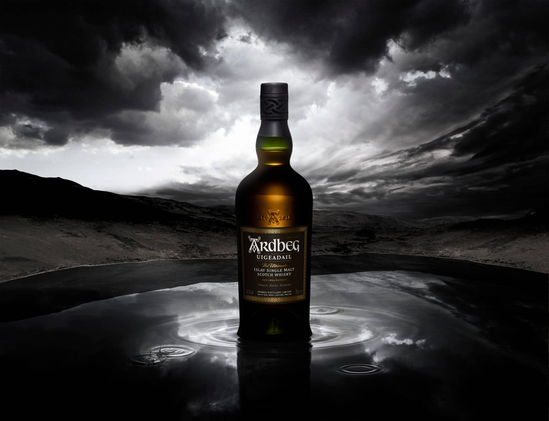 A Mysterious Sip - Ardbeg Uigeadail Whisky Under A Stormy Sky Background