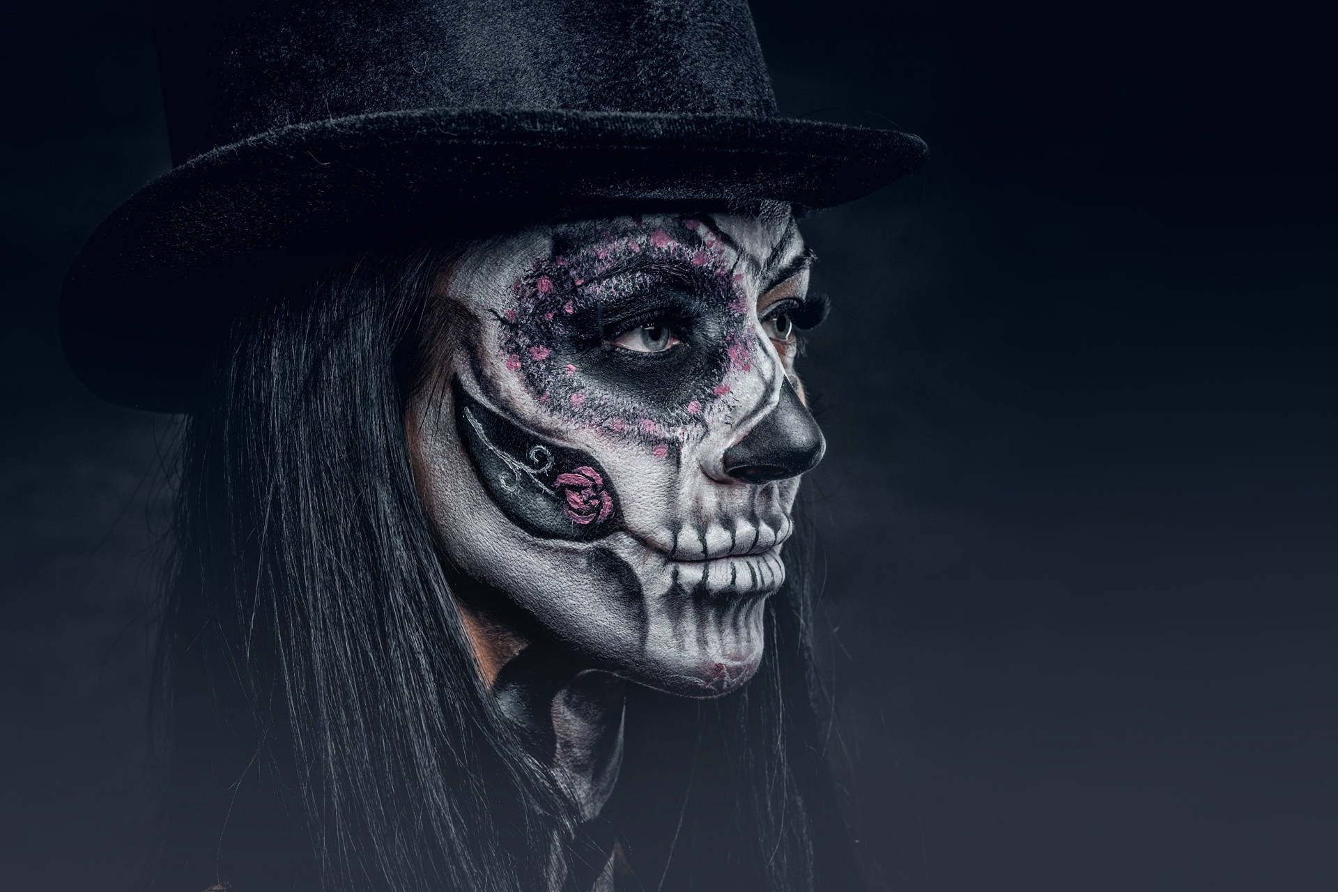 A Mysterious Sugar Skull Person In A Tophat Background