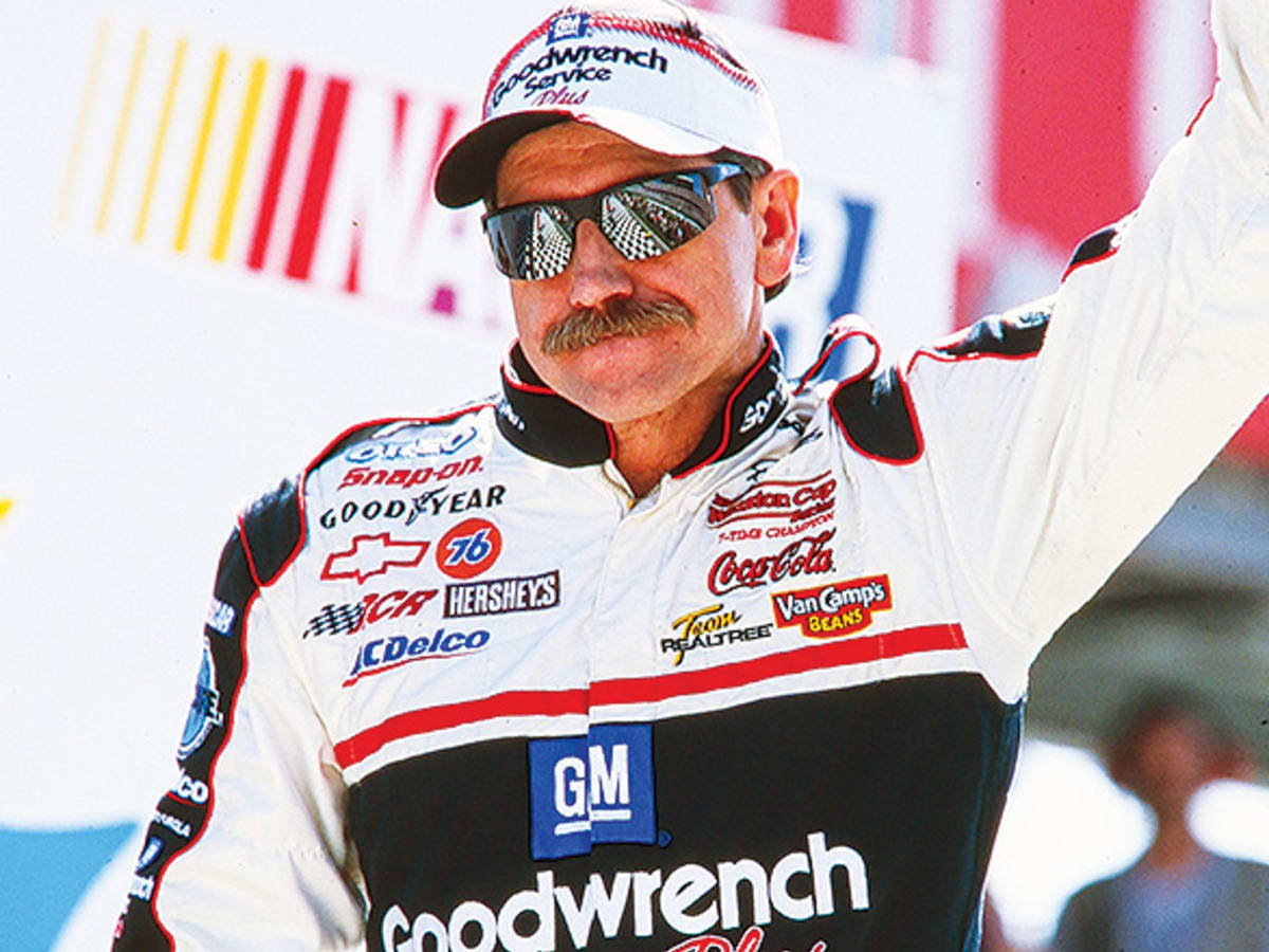 A Nascar Driver With A Mustache And Sunglasses Background