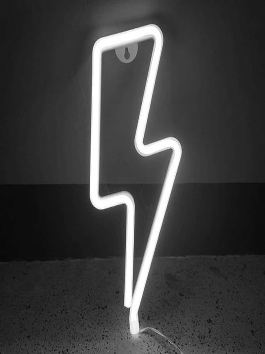 A Neon Lightning Bolt Sign Is Shown In A Dark Room Background