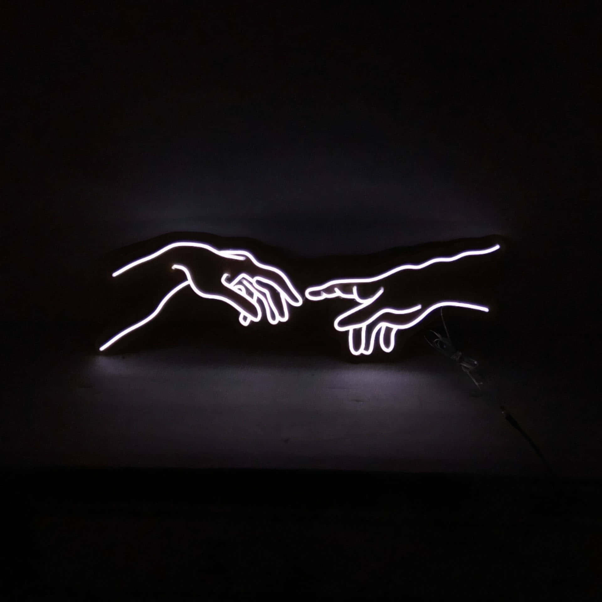 A Neon Sign Showing The Creation Of Adam Background