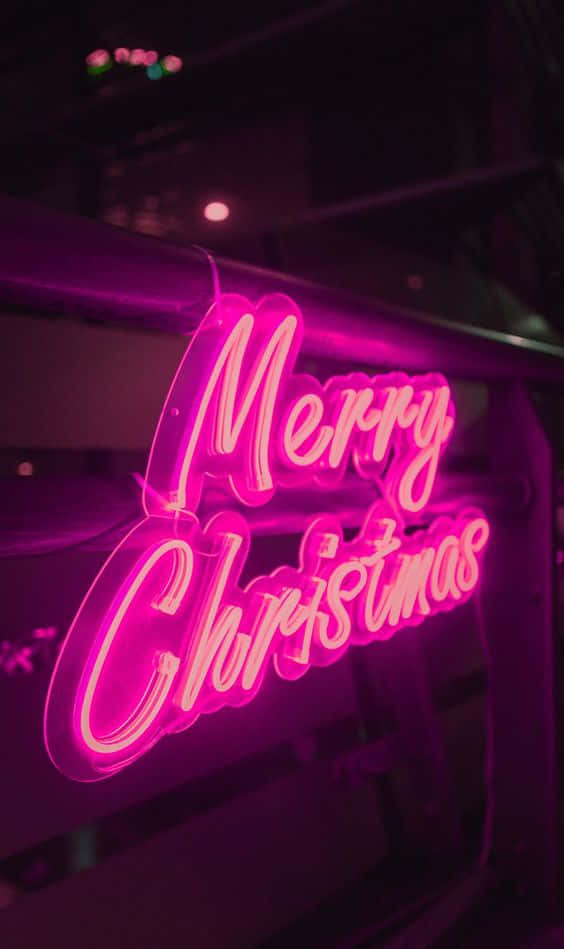 A Neon Sign With The Word Merry Christmas Background