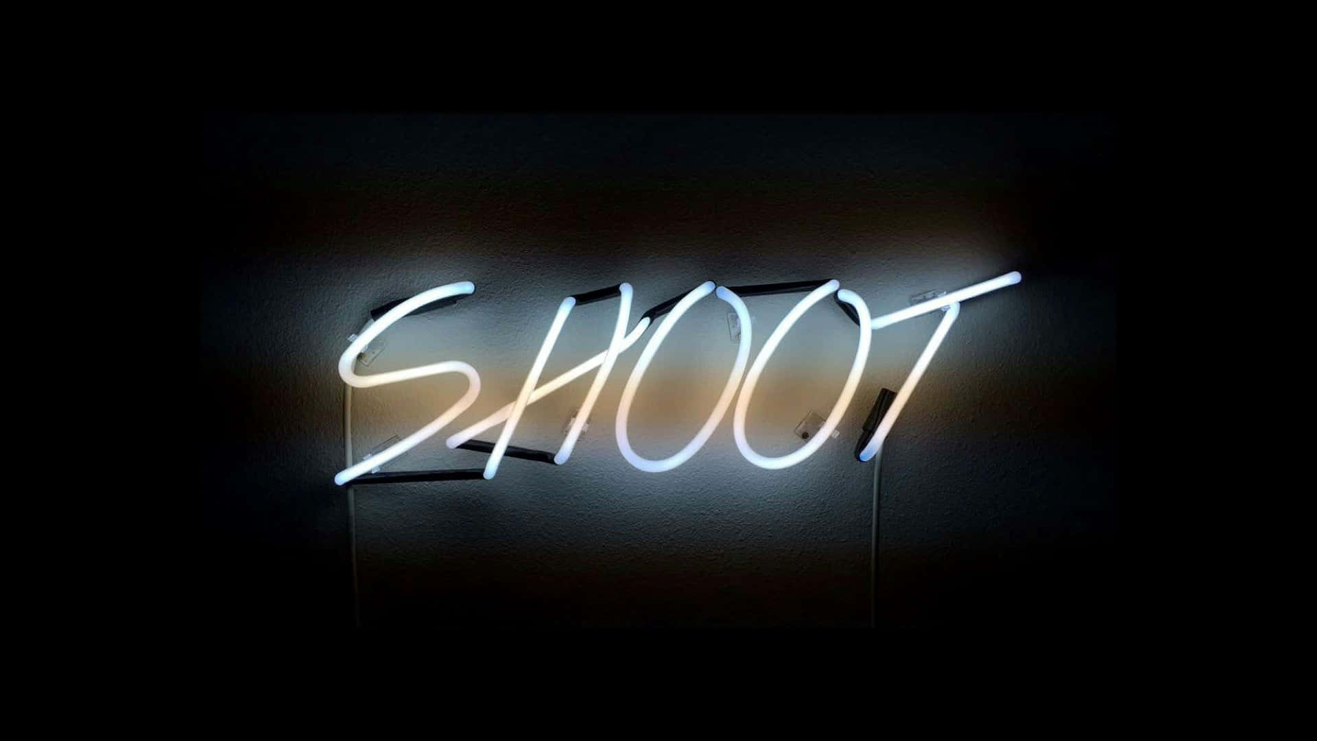 A Neon Sign With The Word Shoot On It