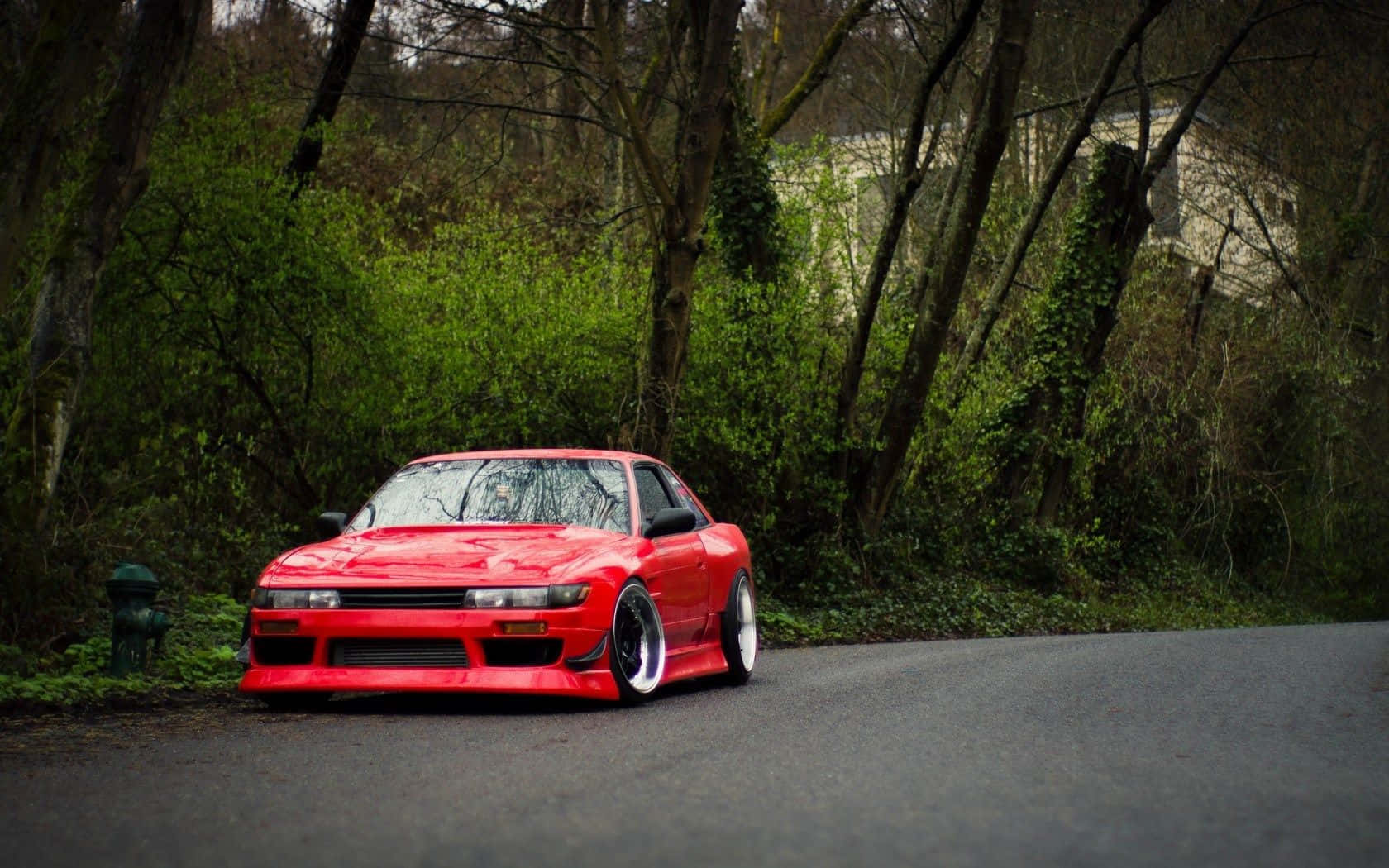 A Nissan Silvia S13 Sitting On A Track In The Twilight Background