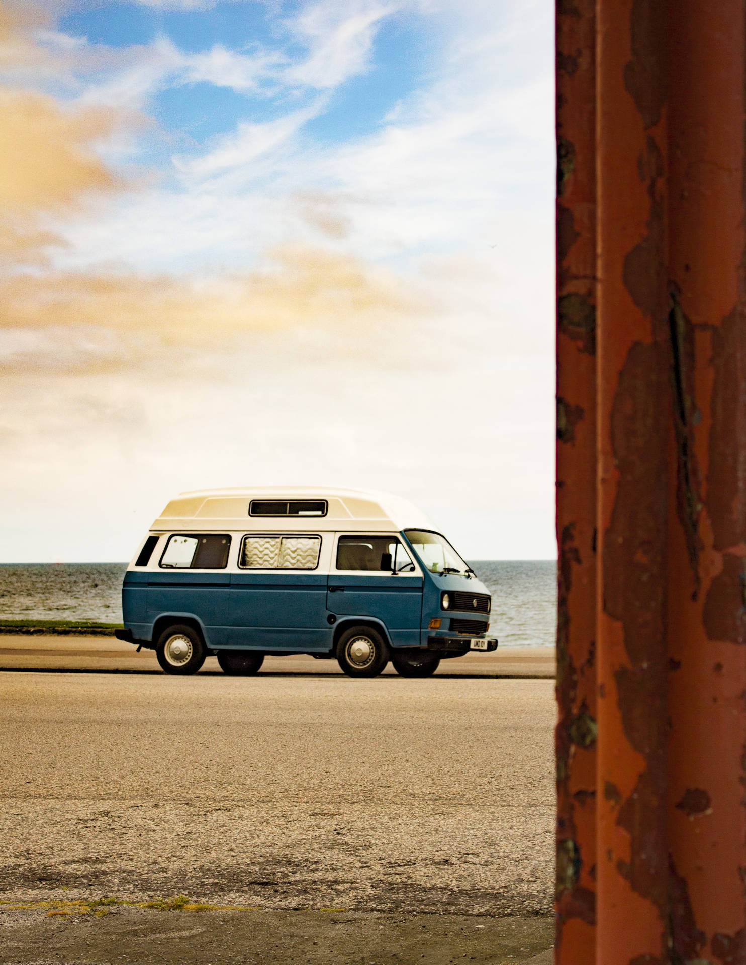 A Nostalgic Ride With A Volkswagen Type 2, Embracing The 70s Retro Aesthetic.