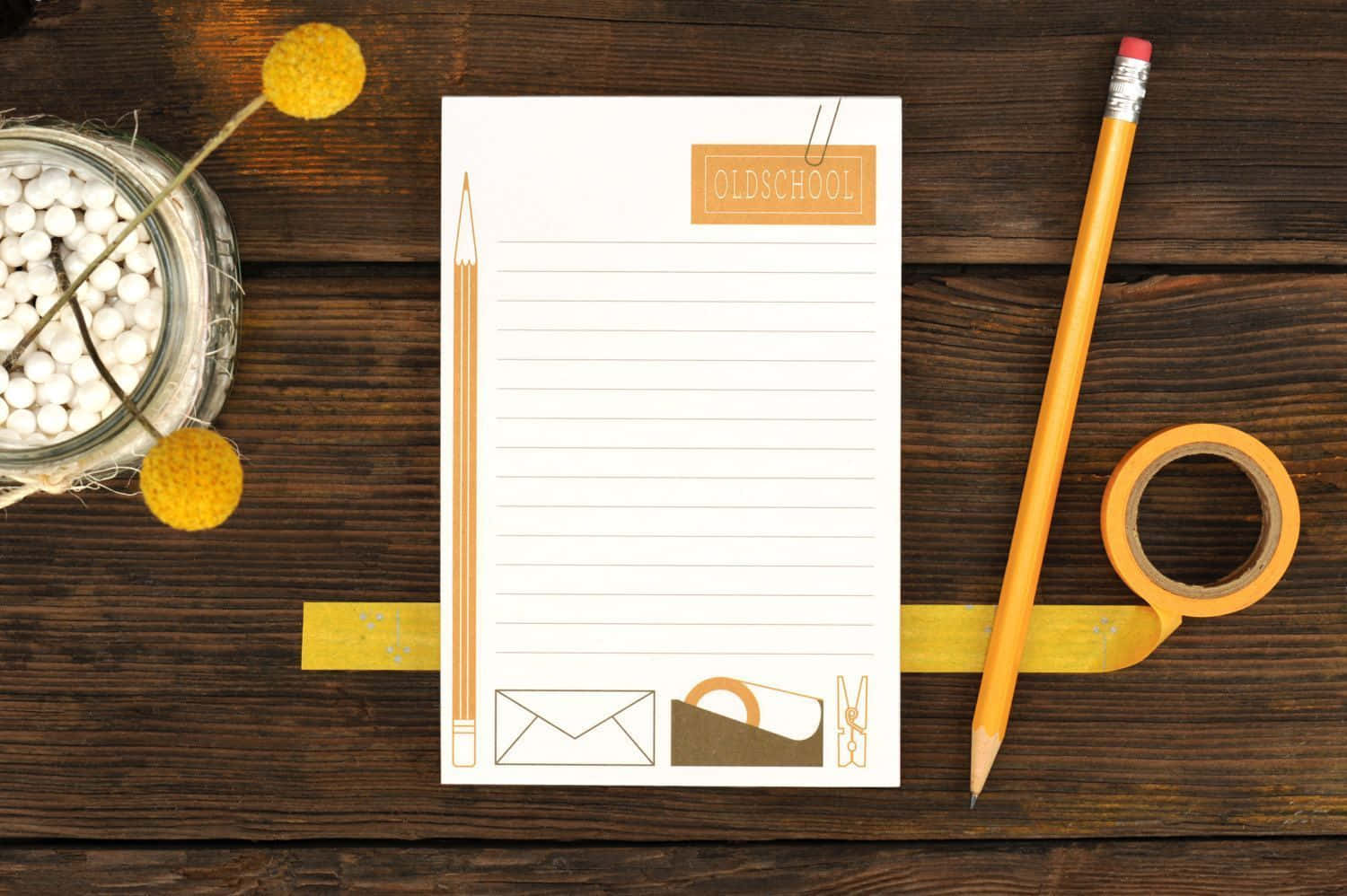 A Notepad With A Pencil And A Yellow Flower Background