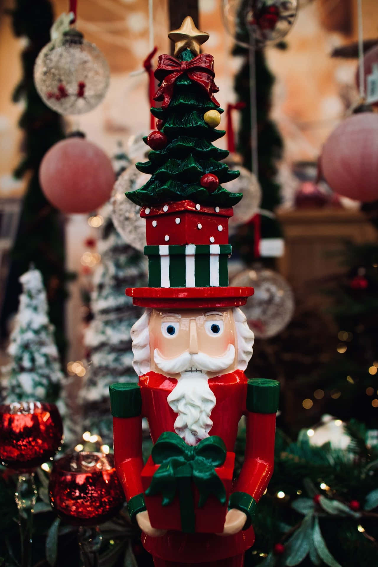 A Nutcracker With A Christmas Tree In Front Of A Christmas Tree Background