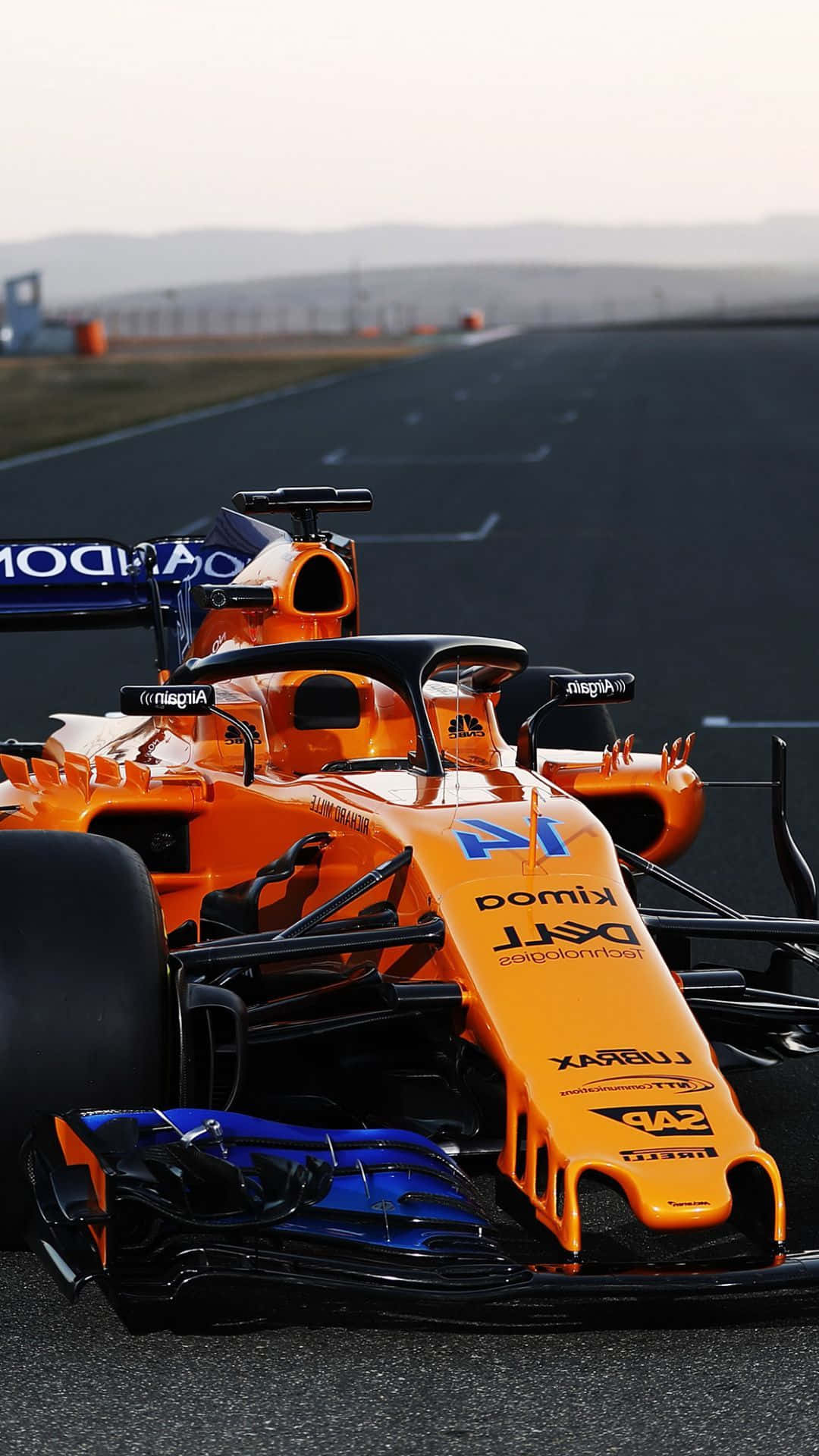 A Orange And Blue Racing Car On A Track Background