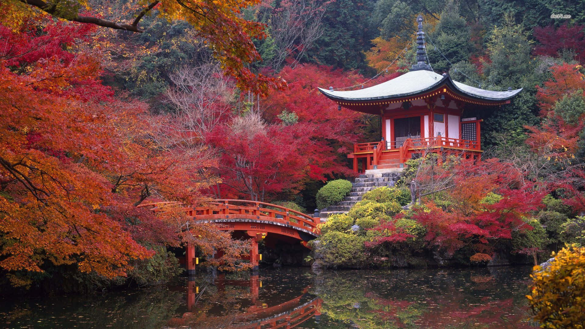 A Pagoda Surrounded By Autumn Leaves And A Pond