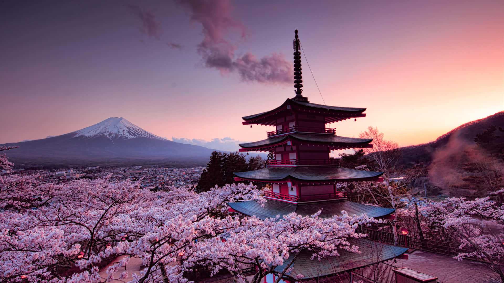 A Pagoda With Cherry Blossoms And A Mountain In The Background Background