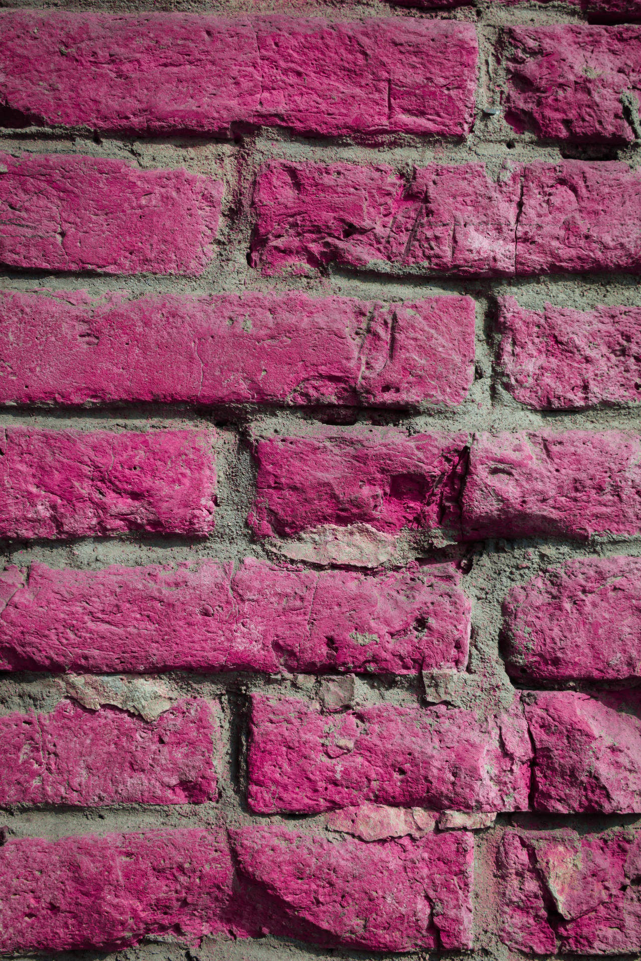 A Painted Brick Pink Wall Background