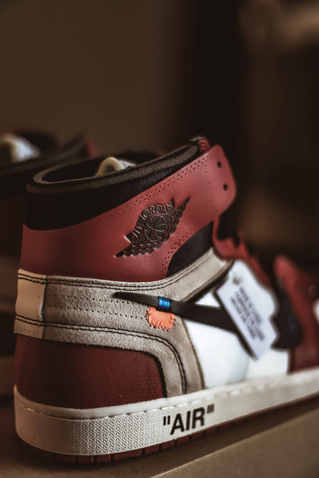 A Pair Of Air Jordan 1's With A Red And White Color Scheme Background