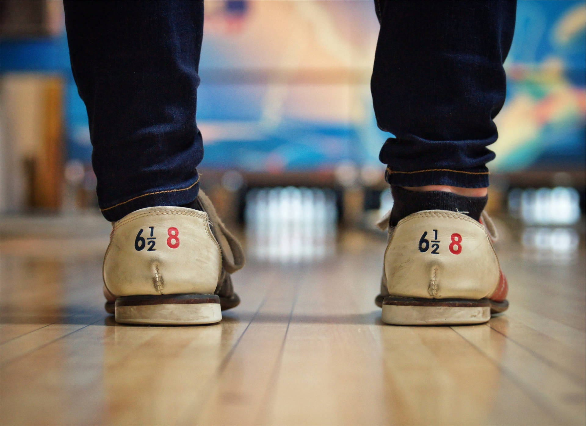 A Pair Of Bowling Shoes On The Floor Background