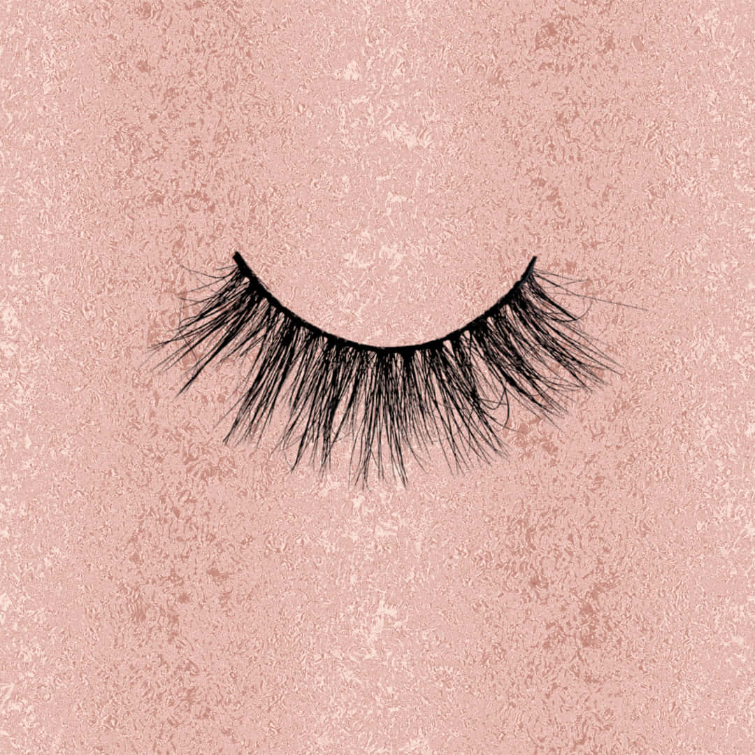 A Pair Of False Eyelashes On A Pink Background Background