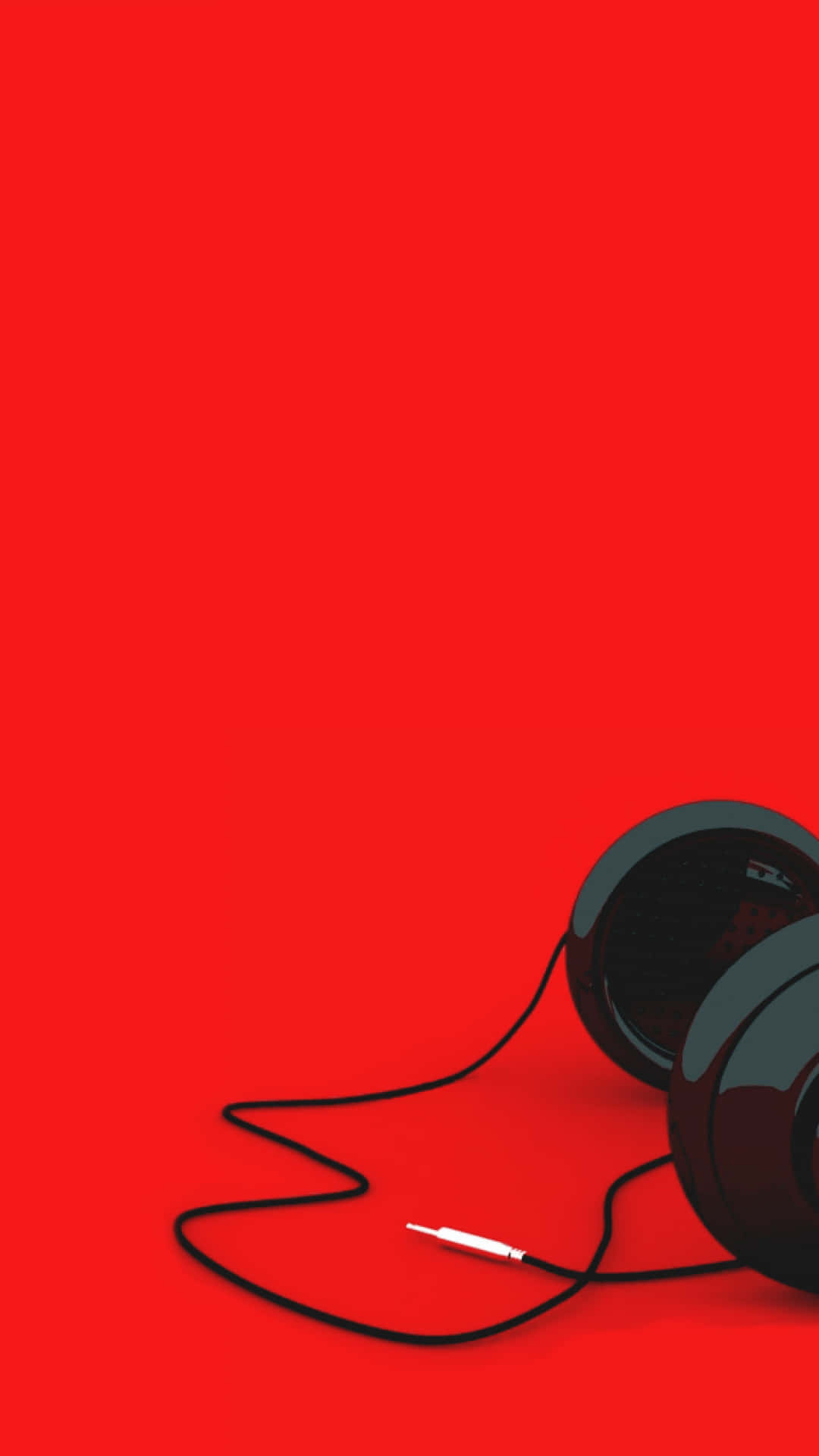 A Pair Of Headphones On A Red Background