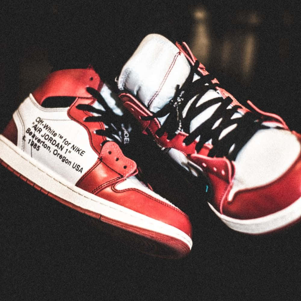 A Pair Of Red And White Sneakers With A Quote On Them Background