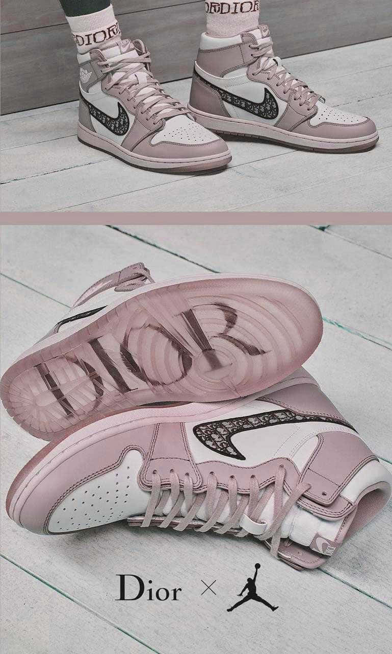 A Pair Of Sneakers With A Pink And White Design Background