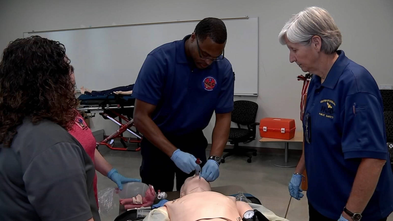 A Paramedic Performing Intubation During Workshop Background