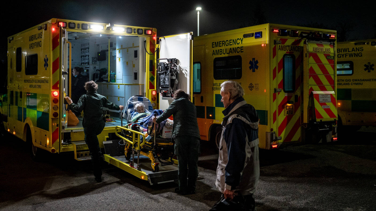 A Paramedic Team Swiftly Responding To An Emergency Background