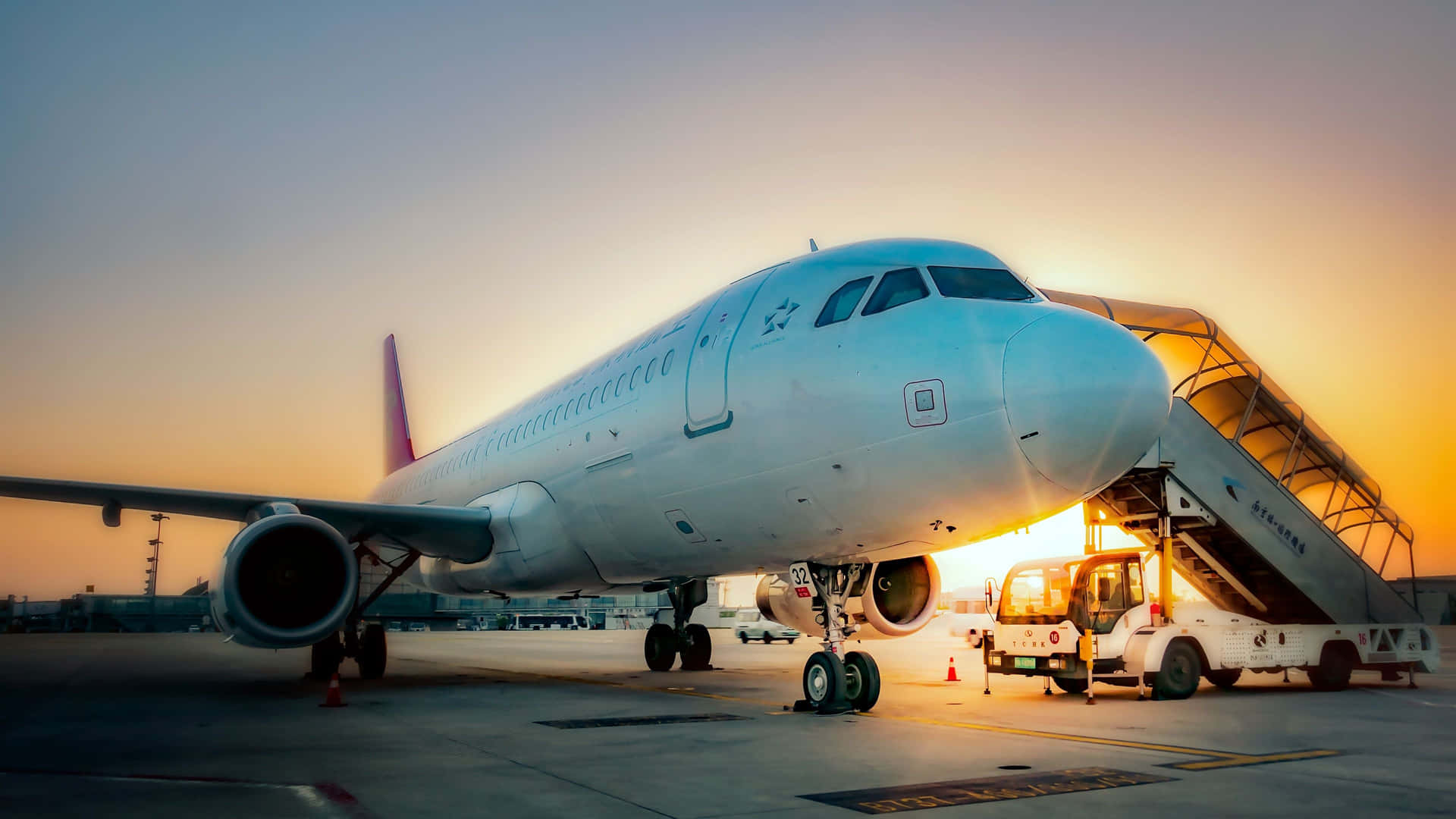 A Passenger Airplane Is Parked At An Airport