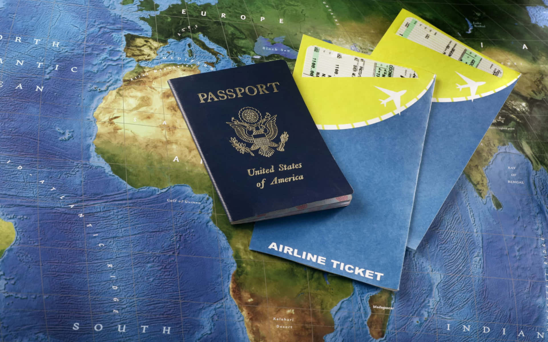 A Passport And A Ticket On A Map Background