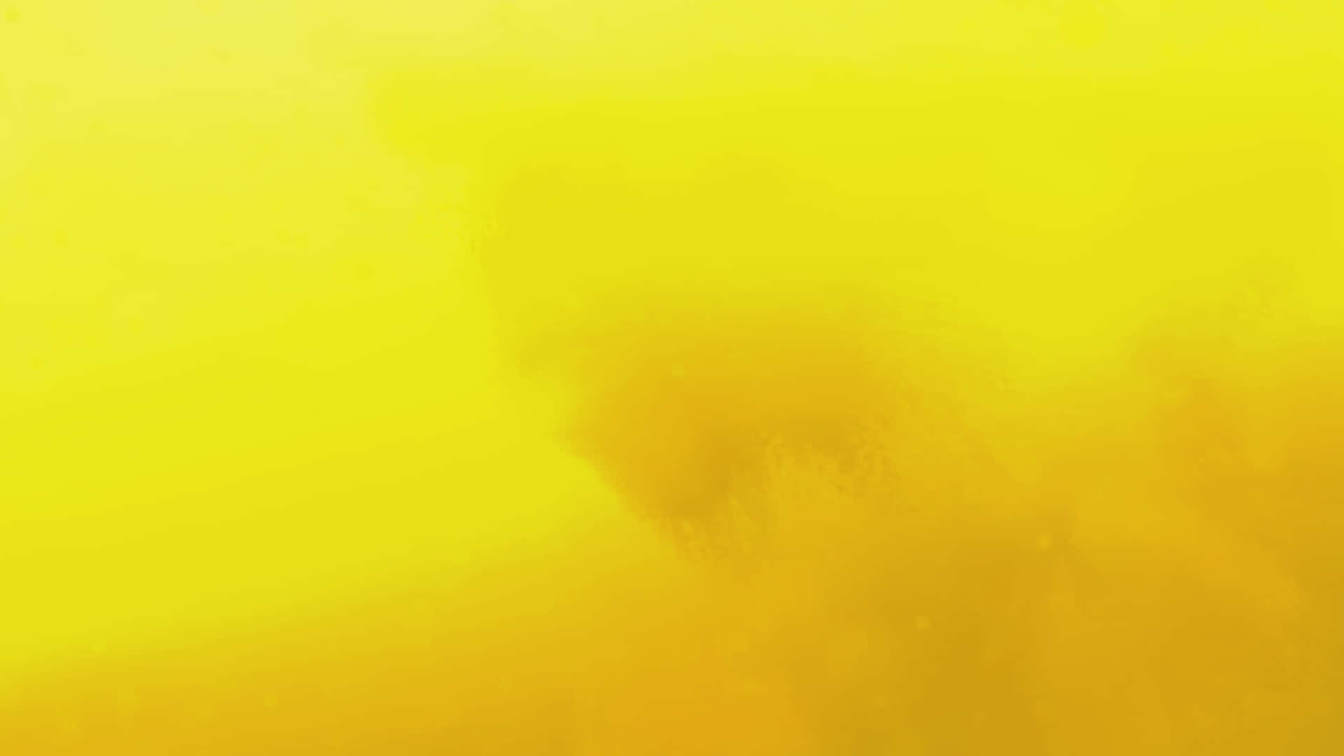 A Pastel Yellow Laptop Sits On A Desk, Ready For Its Next Project Background