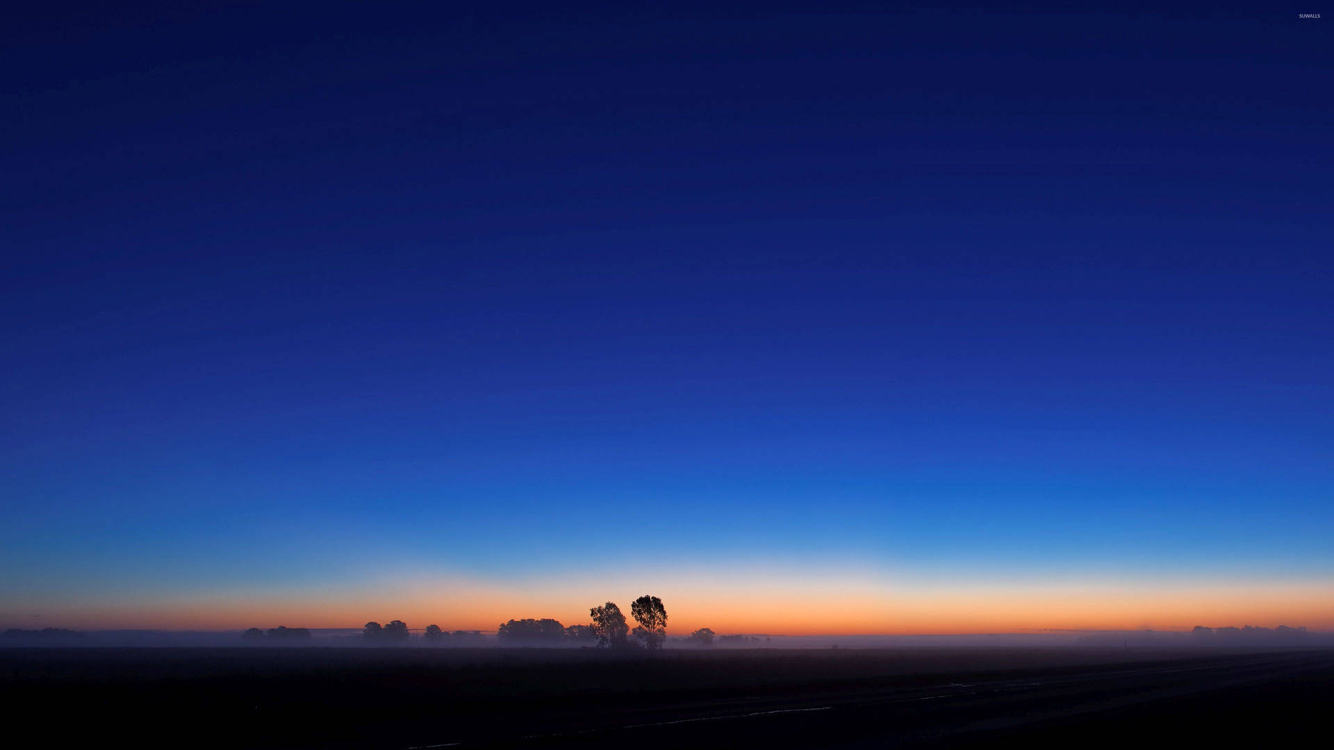 A Peaceful Blue Sunrise Paints The Sky Background