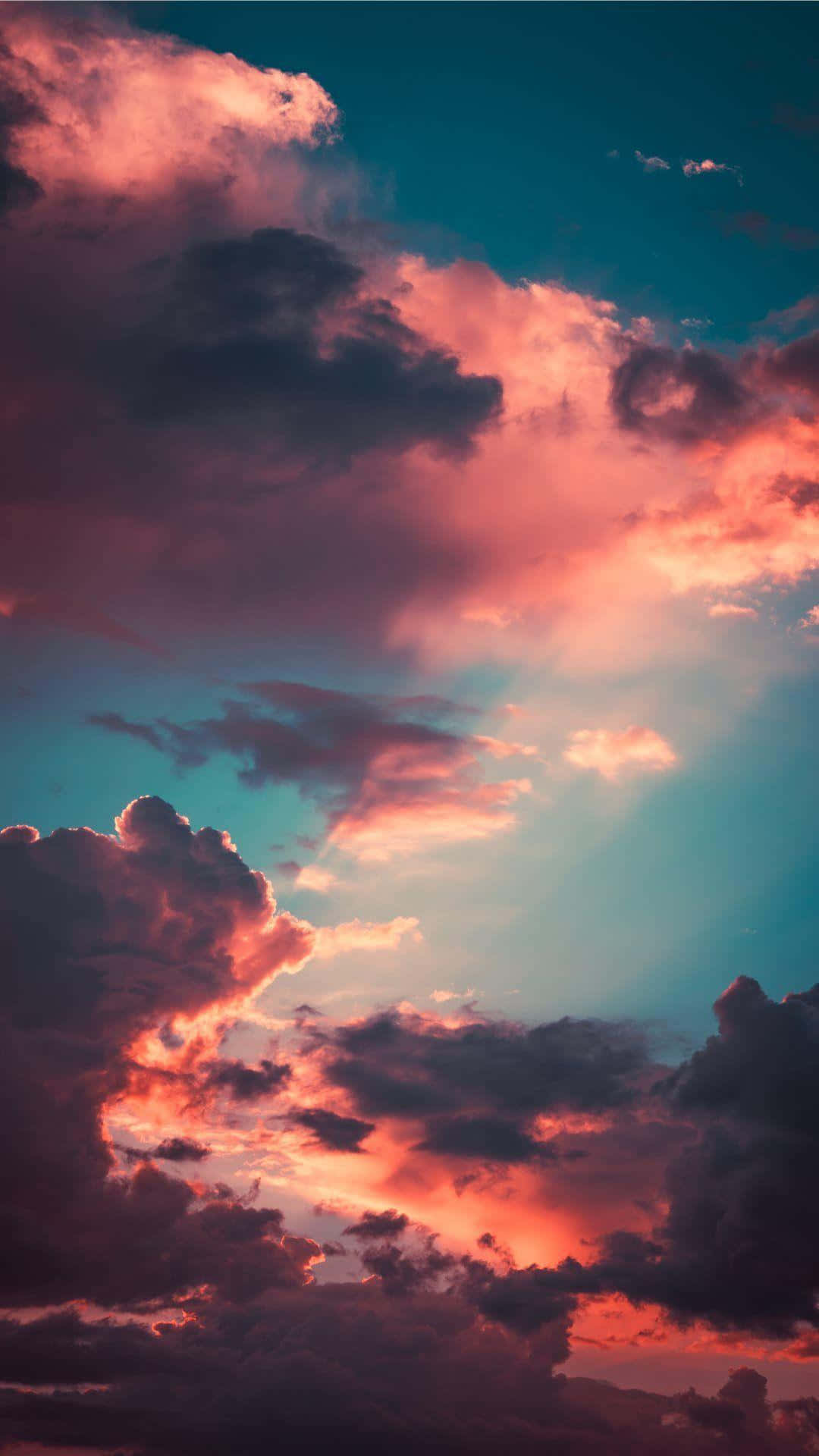 A Peaceful Scene Of Nature Captured Against A Stormy Sky. Background