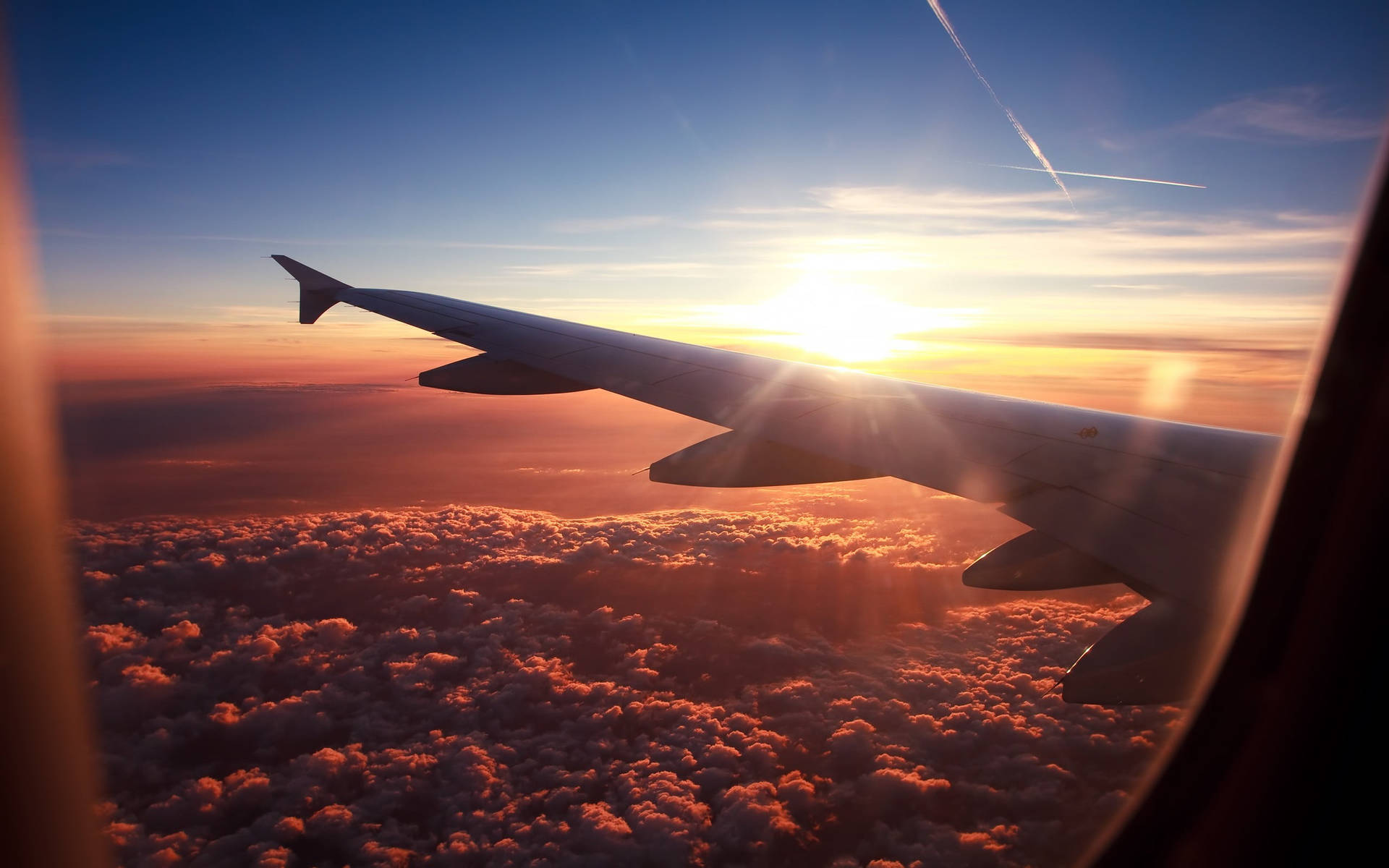 A Peek To A Sunny Horizon From A Plane Window Background