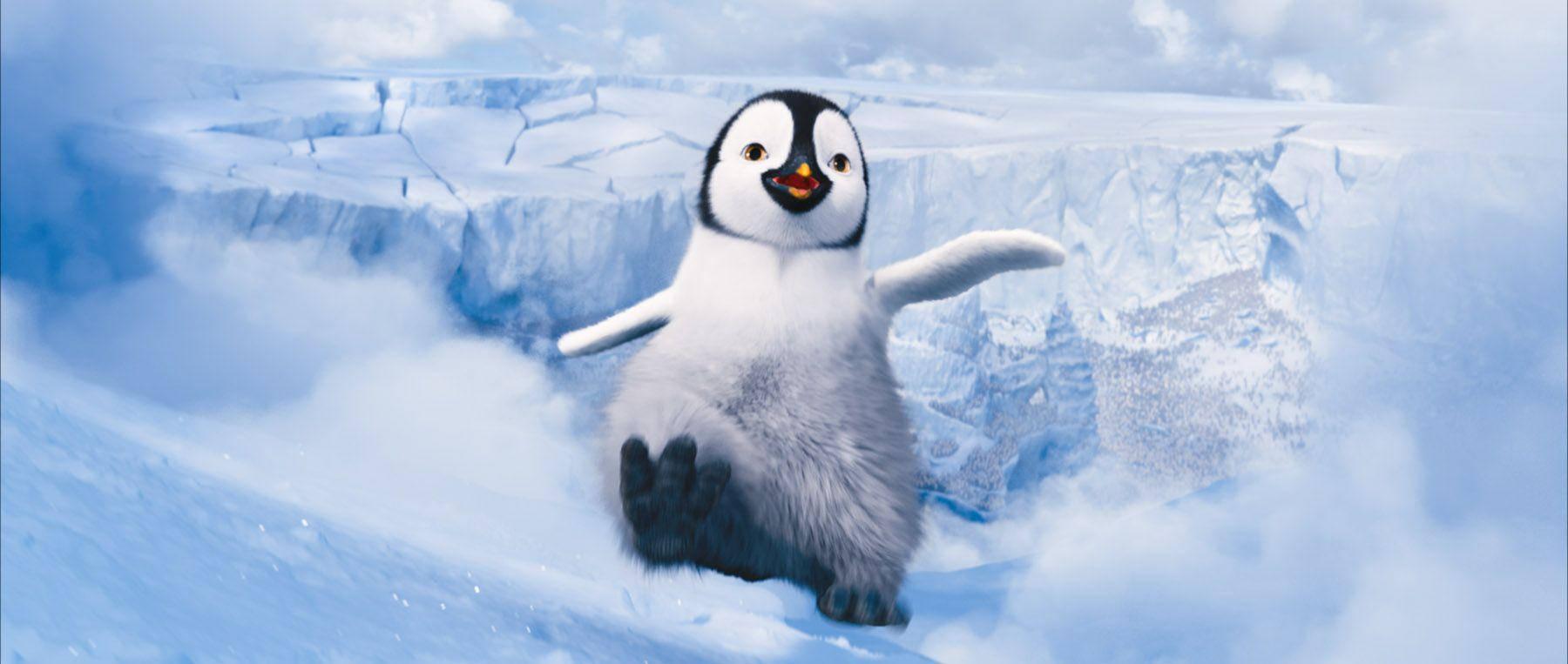 A Penguin Is Running On Top Of A Snowy Mountain