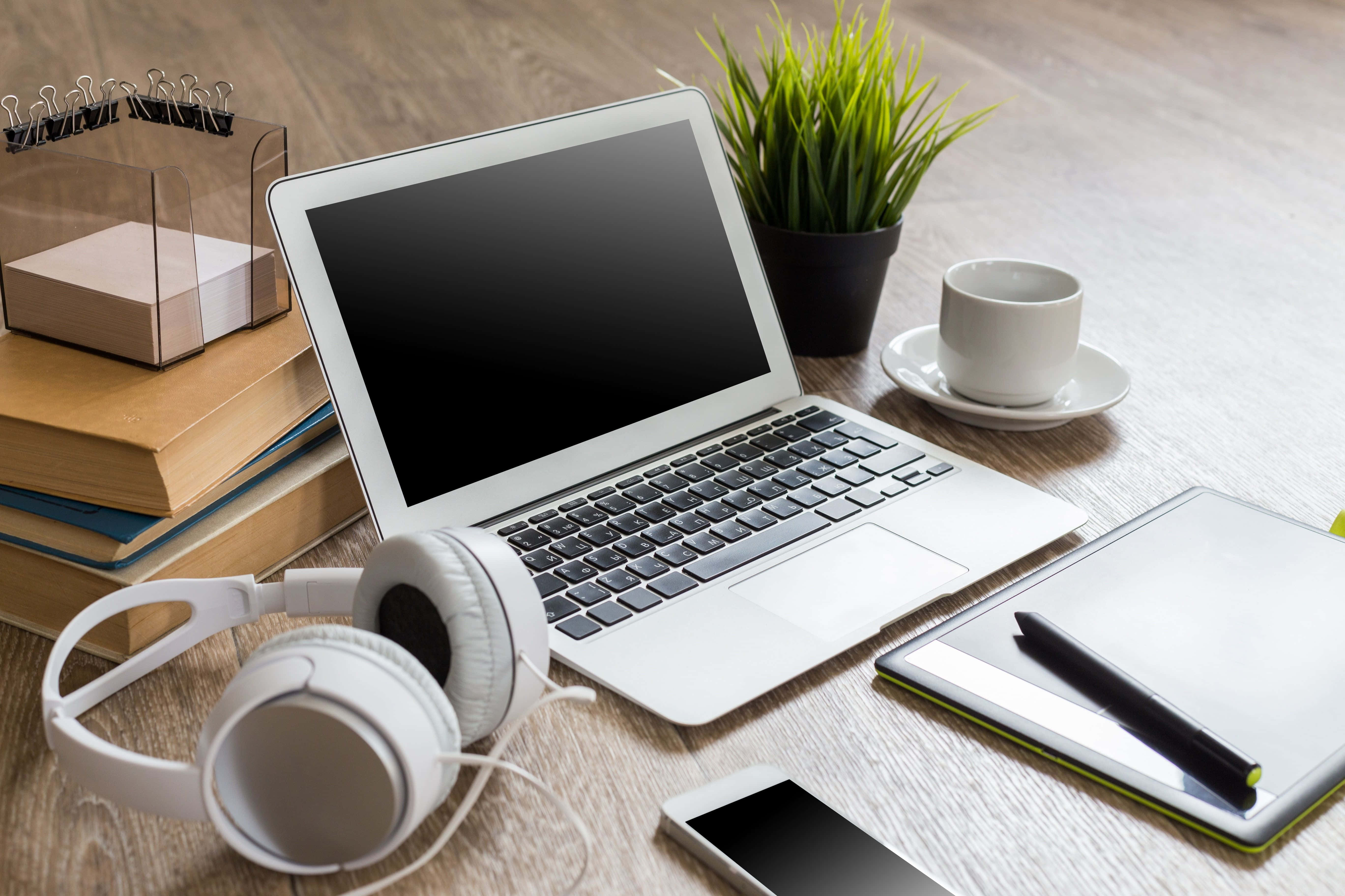 A Person Getting Lost In Their Music While Working On Their Laptop