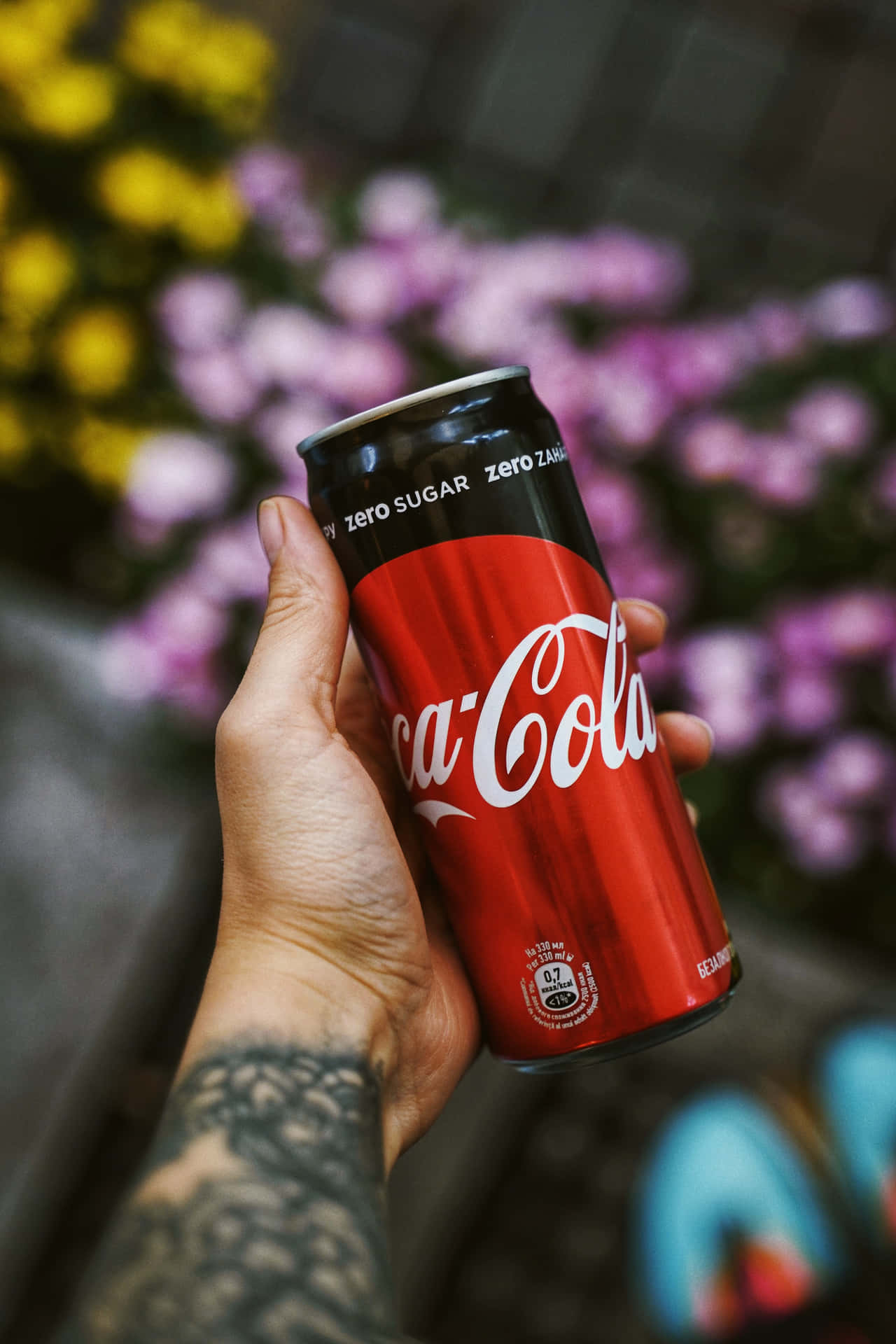 A Person Holding A Coca Cola Can Background