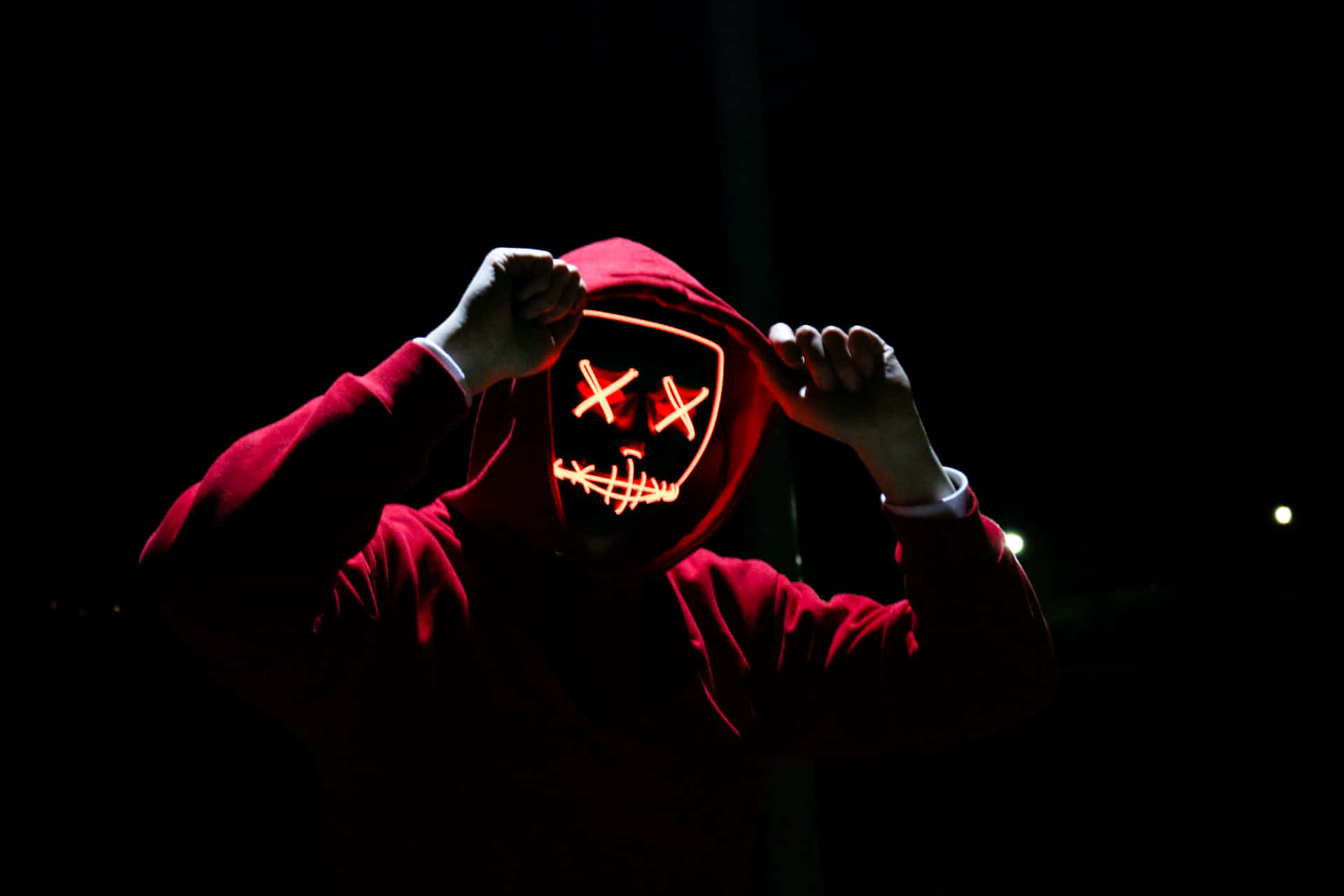 A Person In A Red Hoodie Background