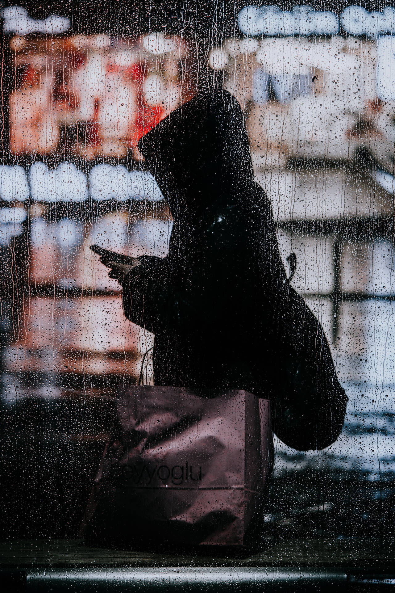 A Person Is Standing In The Rain Background
