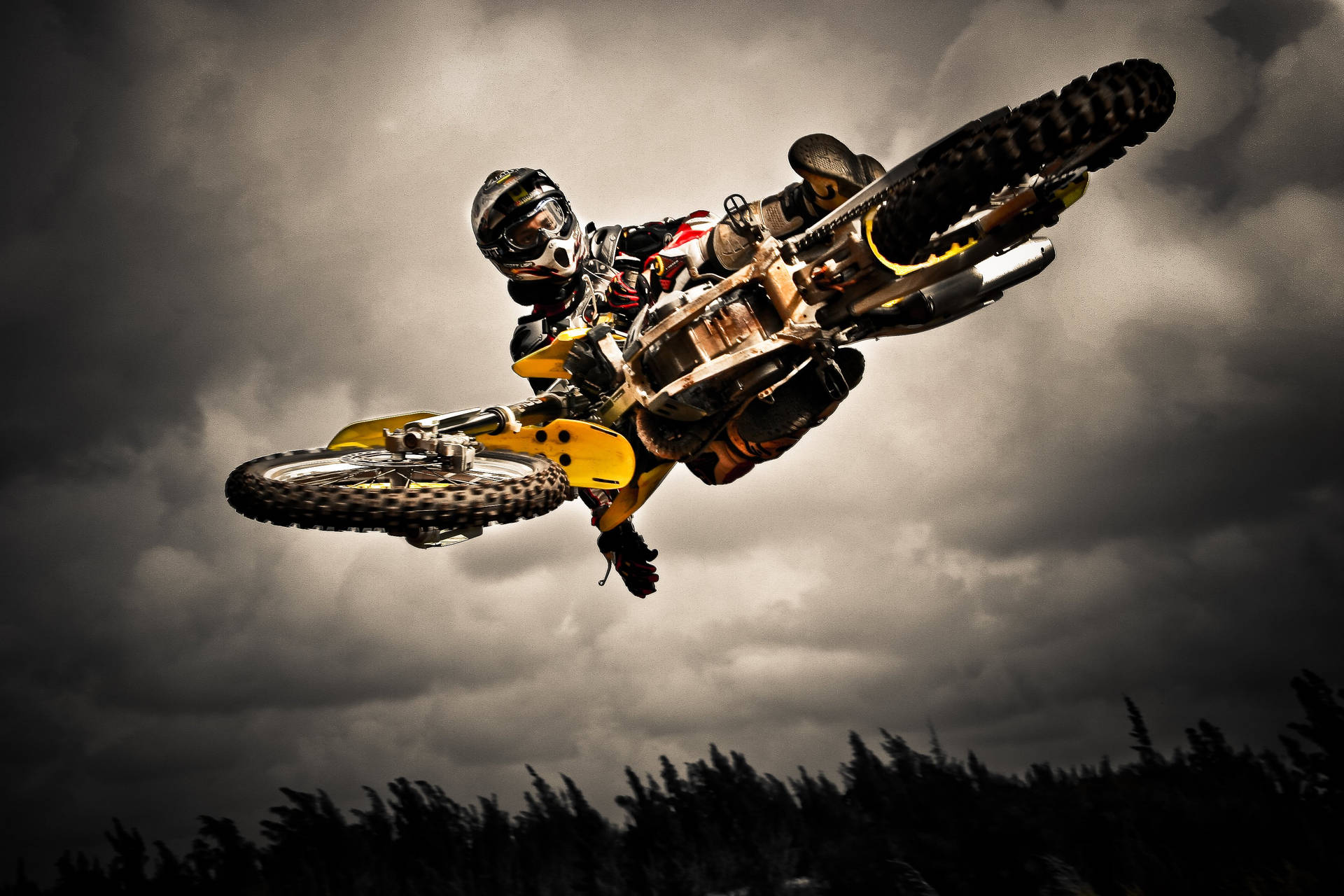 A Person Riding A Dirt Bike Background