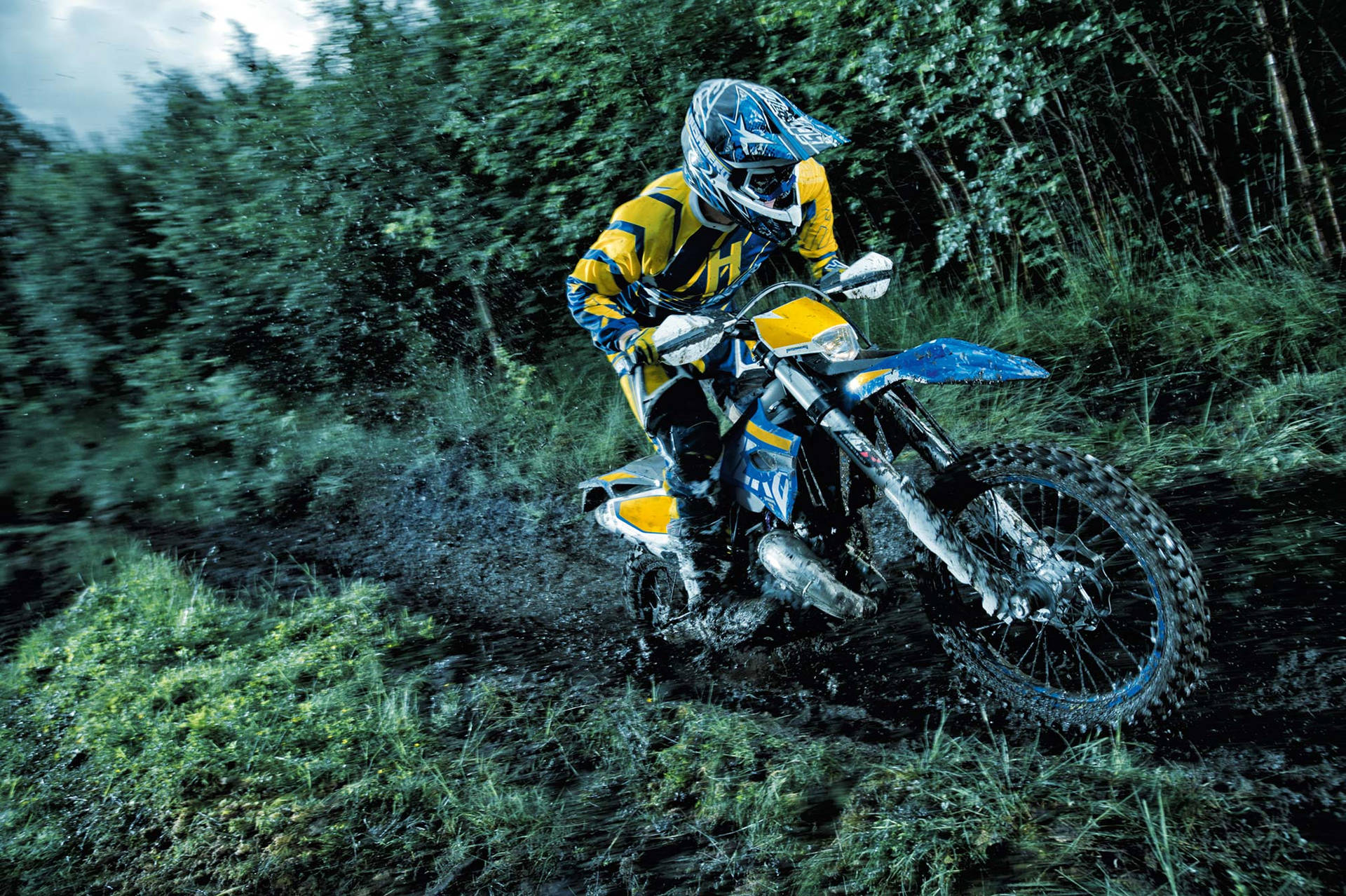 A Person Riding A Dirt Bike Background