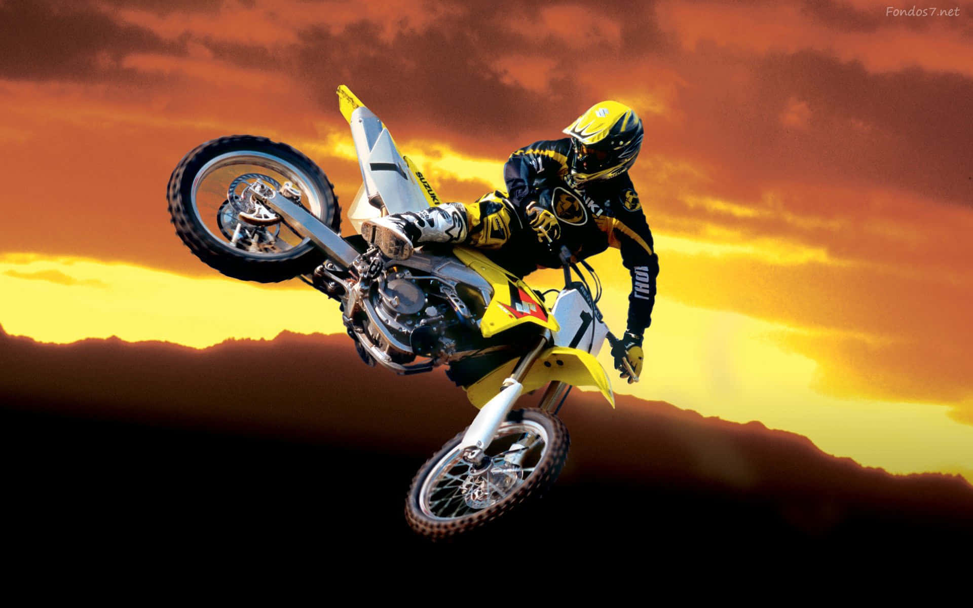 A Person Riding A Dirt Bike Background