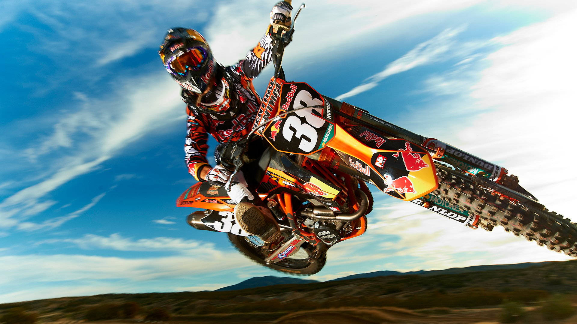 A Person Riding A Dirt Bike Background