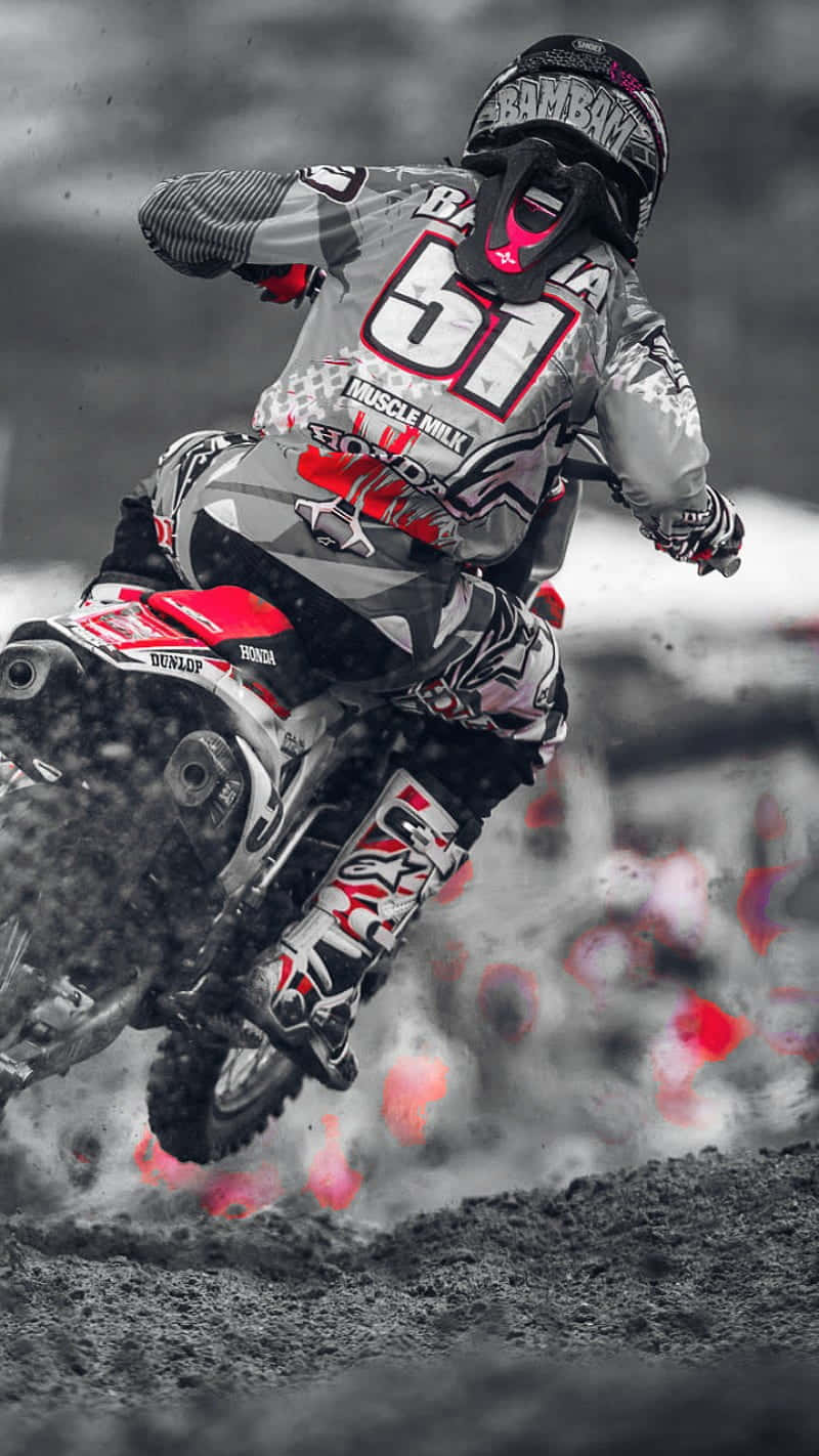 A Person Riding A Dirt Bike Background