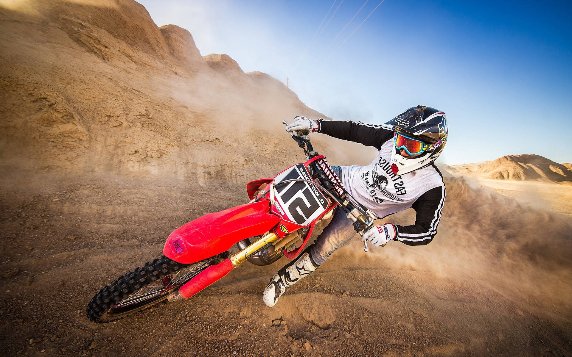 A Person Riding A Dirt Bike Background