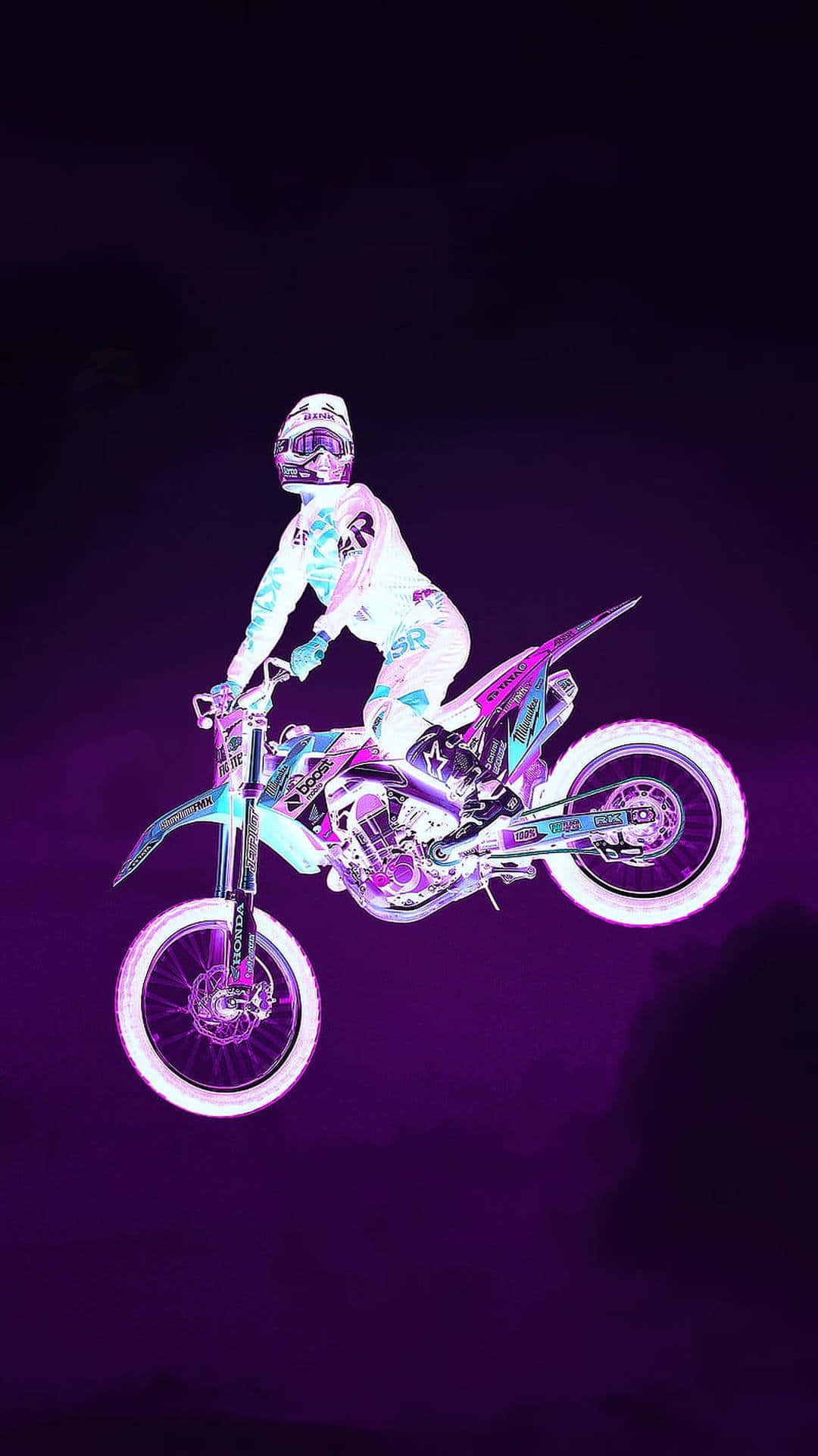 A Person Riding A Dirt Bike In The Air Background