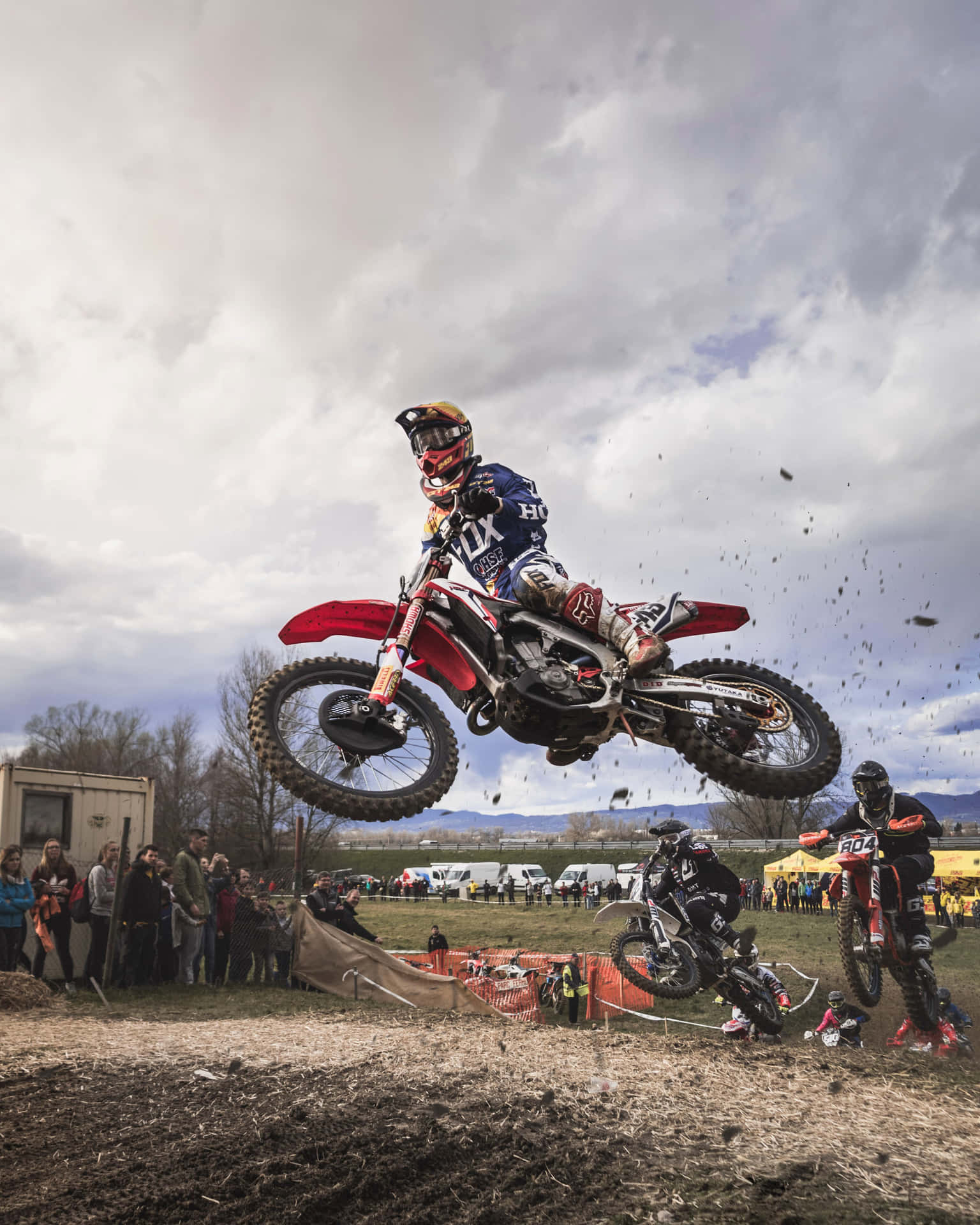 A Person Riding A Dirt Bike In The Air Background