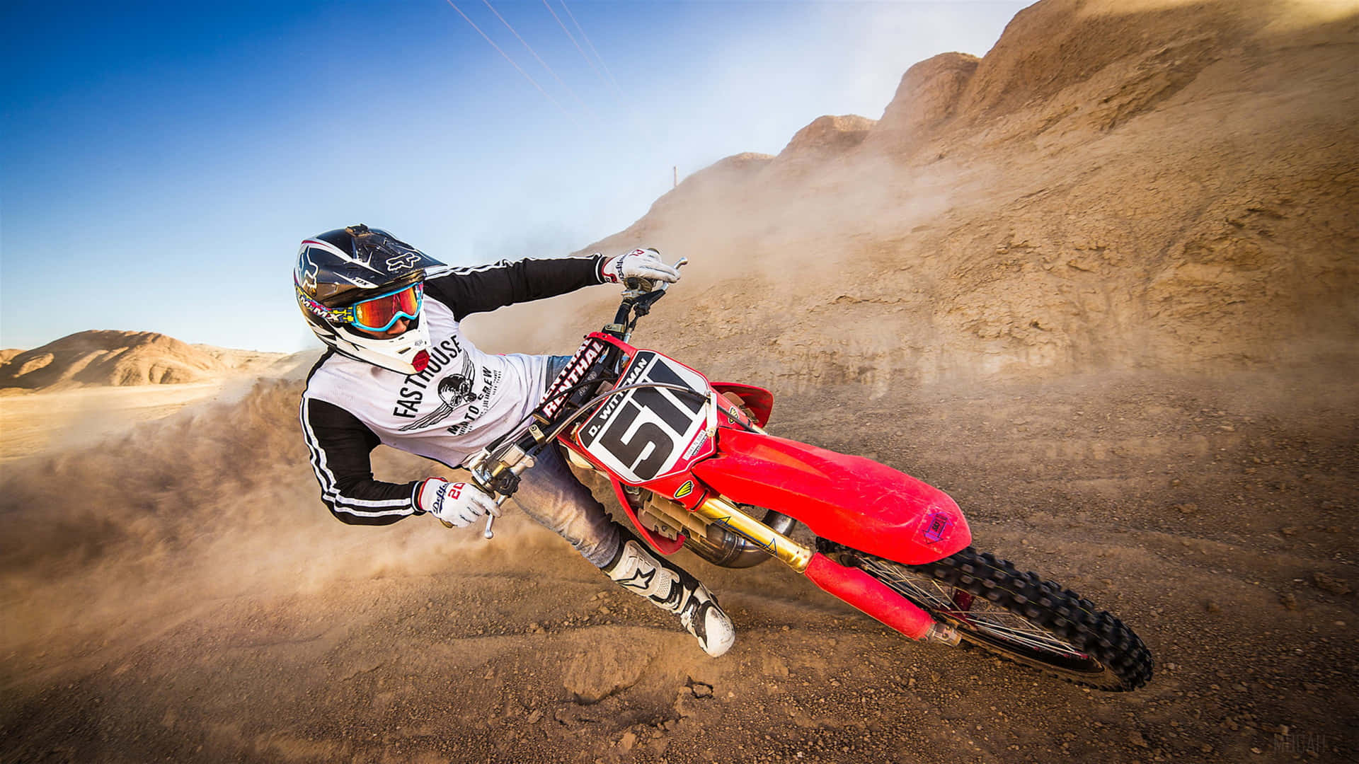 A Person Riding A Dirt Bike Background